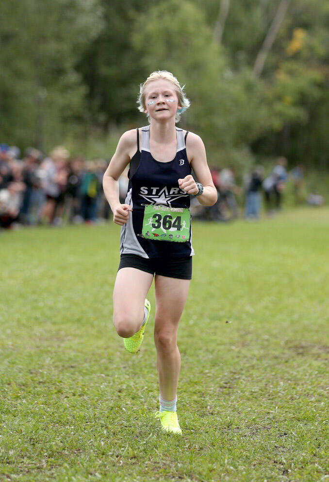 Soldotna freshman Sophia Jedlicki sprints to a first-place finish in the varsity girls race during the Colony Invitational on Saturday, Aug. 27, 2022, at Colony High School in Palmer, Alaska. (Photo by Bruce Eggleston/matsusports.net)