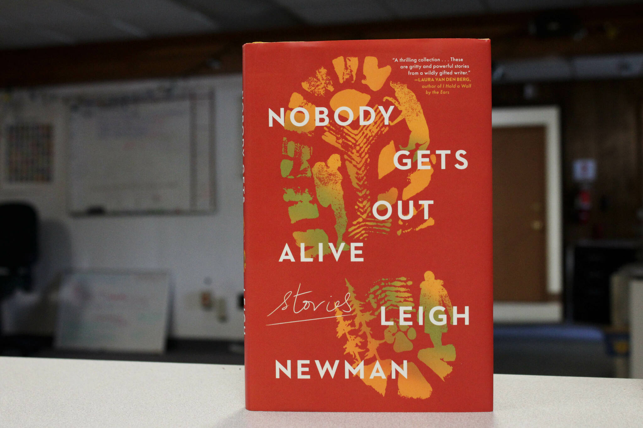 A copy of "Nobody Gets Out Alive" stands on a desk inside The Peninsula Clarion's offices on Tuesday, Aug. 30, 2022 in Kenai, Alaska. (Ashlyn O'Hara/Peninsula Clarion)