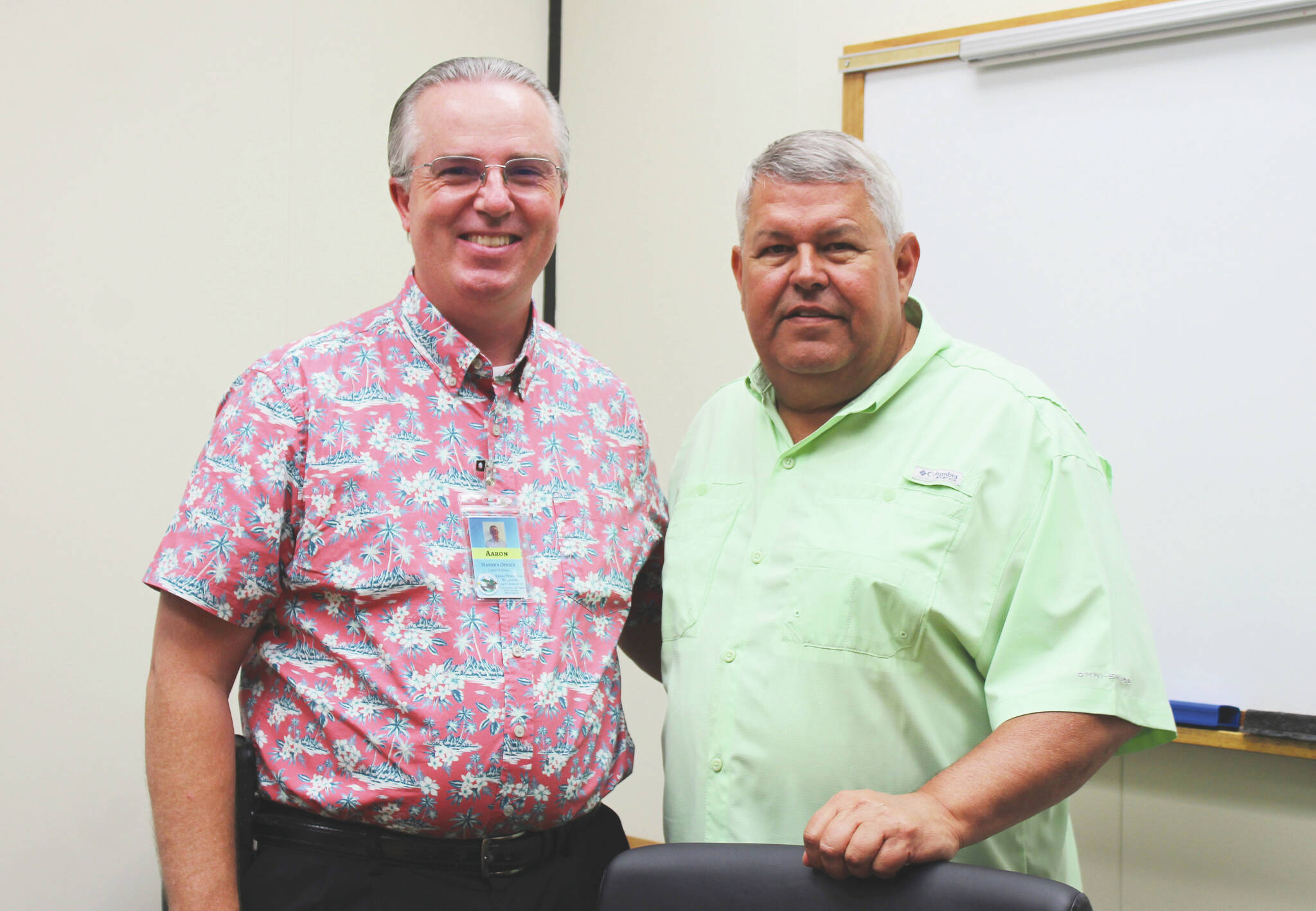 Aaron Rhoades and Charlie Pierce stand in a conference room in the George A. Navarre Borough Administration Building on Tuesday, July 20, 2021, in Soldotna, Alaska. (Ashlyn O’Hara/Peninsula Clarion)