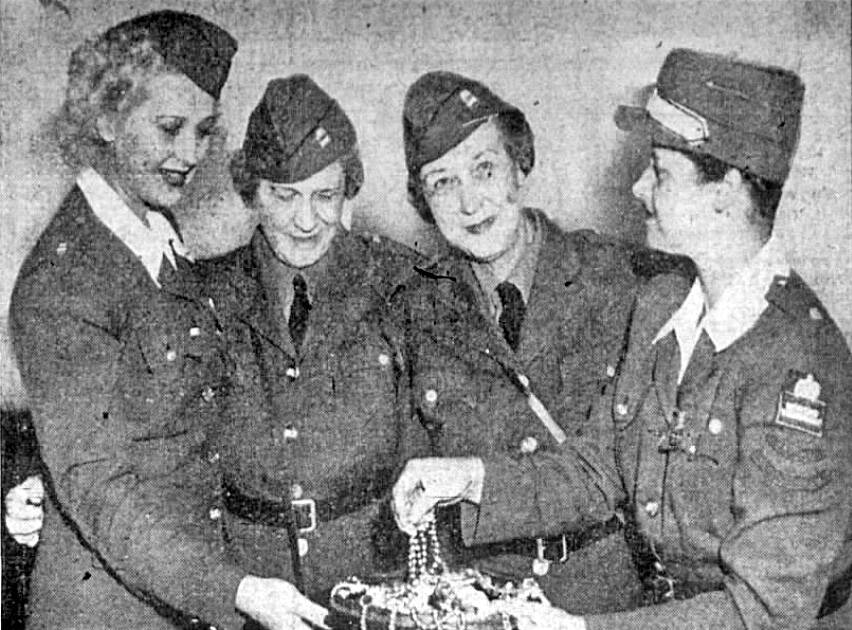 Photo courtesy of Newspapers.com archive 
Sisters Alice M. Brooks and Willietta E. Kuppler (both nee Dolan), seen here (center of photo) in a 1943 Los Angeles newspaper article, taught in Kenai from 1911 to 1914 and came to despise Bill Dawson, whom they referred to as “Old Bible Bill.”