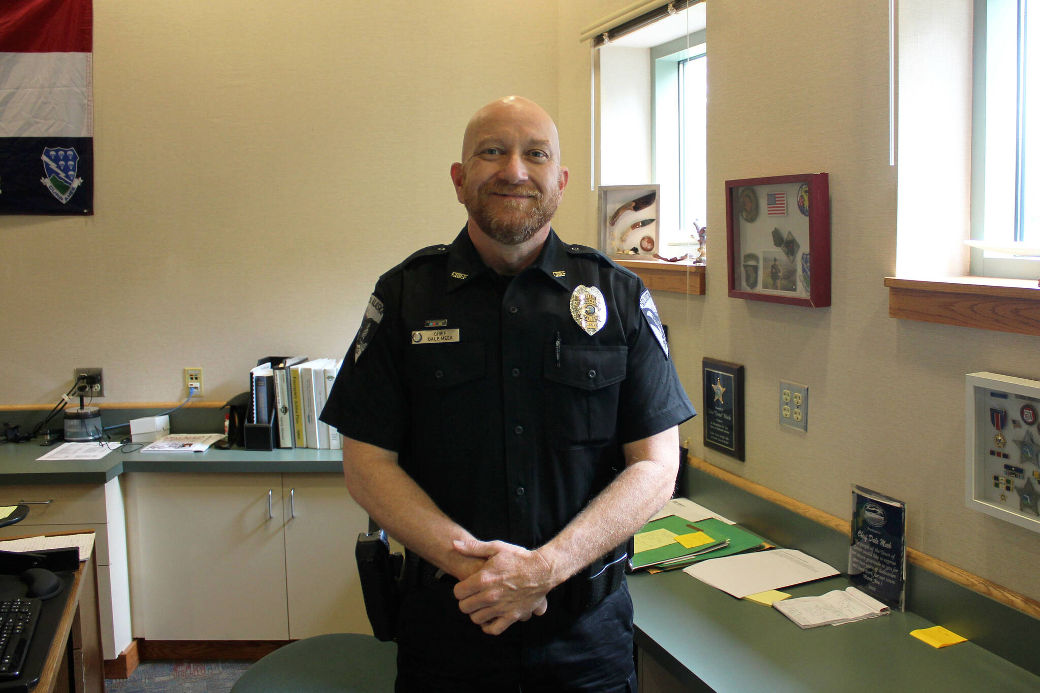 Soldotna Police Chief Dale “Gene” Meek stands in his office on Tuesday, Aug. 30, 2022, in Soldotna, Alaska. (Ashlyn O’Hara/Peninsula Clarion)