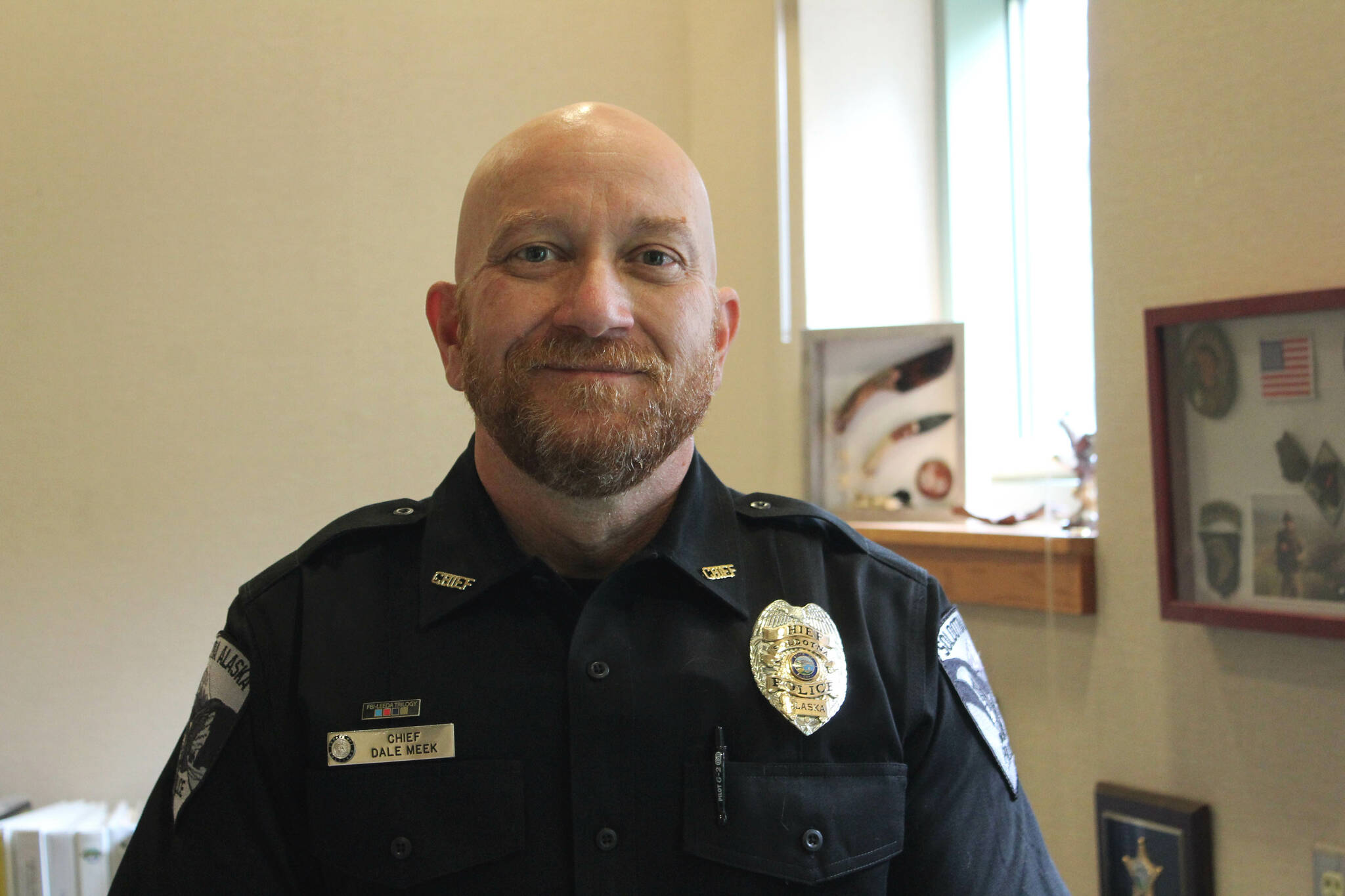 Soldotna Police Chief Dale “Gene” Meek stands in his office on Tuesday, Aug. 30, 2022, in Soldotna, Alaska. (Ashlyn O’Hara/Peninsula Clarion)