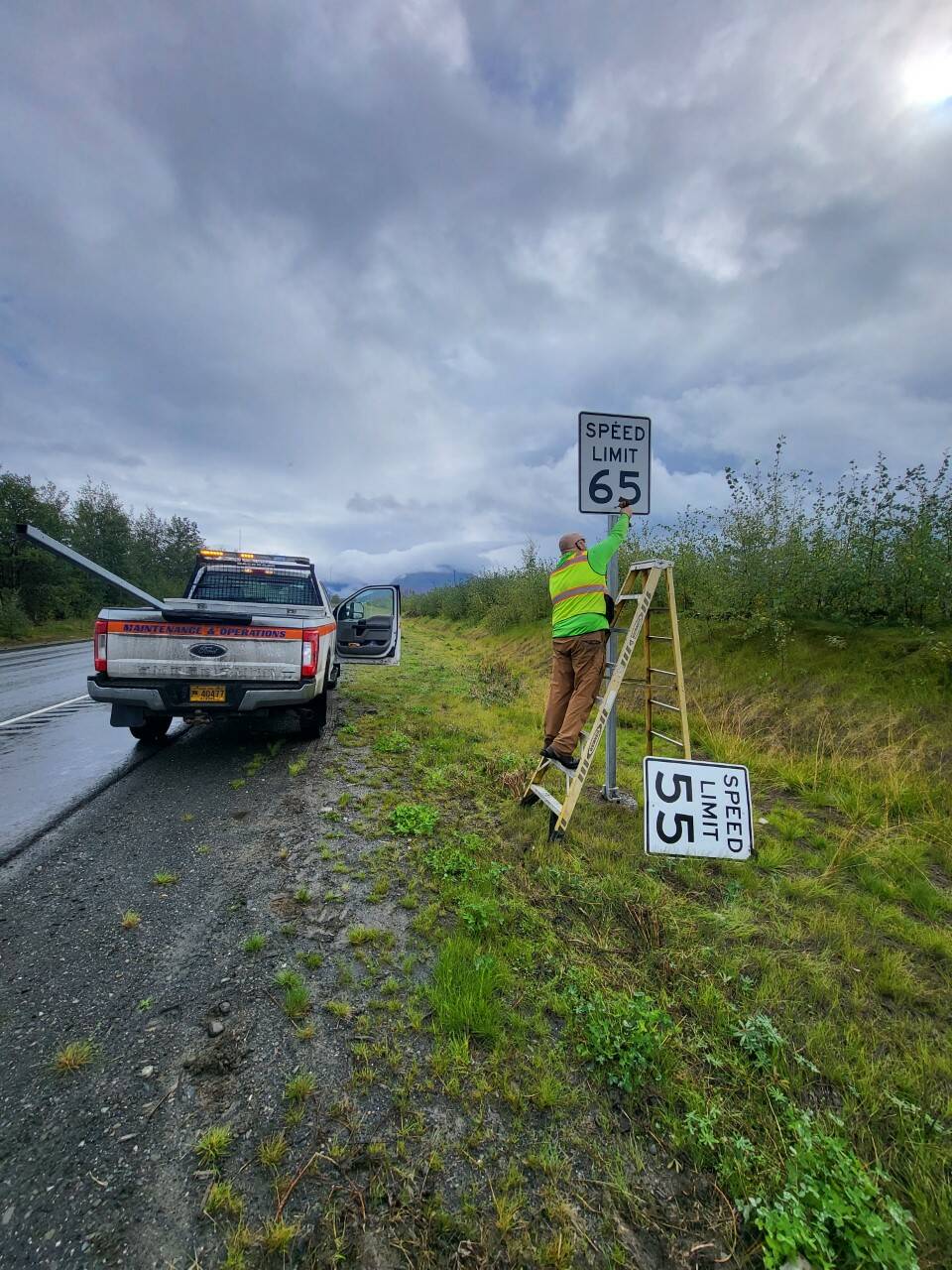 A state employee changes speed limit signs along the Sterling Highway. (Photos courtesy Alaska Department of Transportation & Public Facilities)
