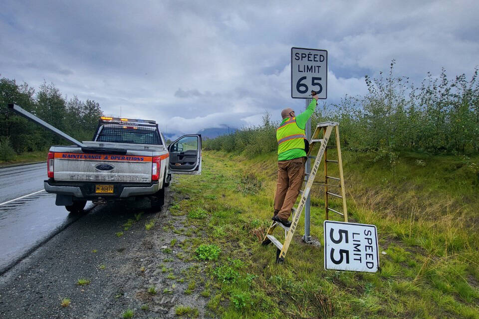 A state employee changes speed limit signs along the Sterling Highway. (Photos courtesy Alaska Department of Transportation & Public Facilities)