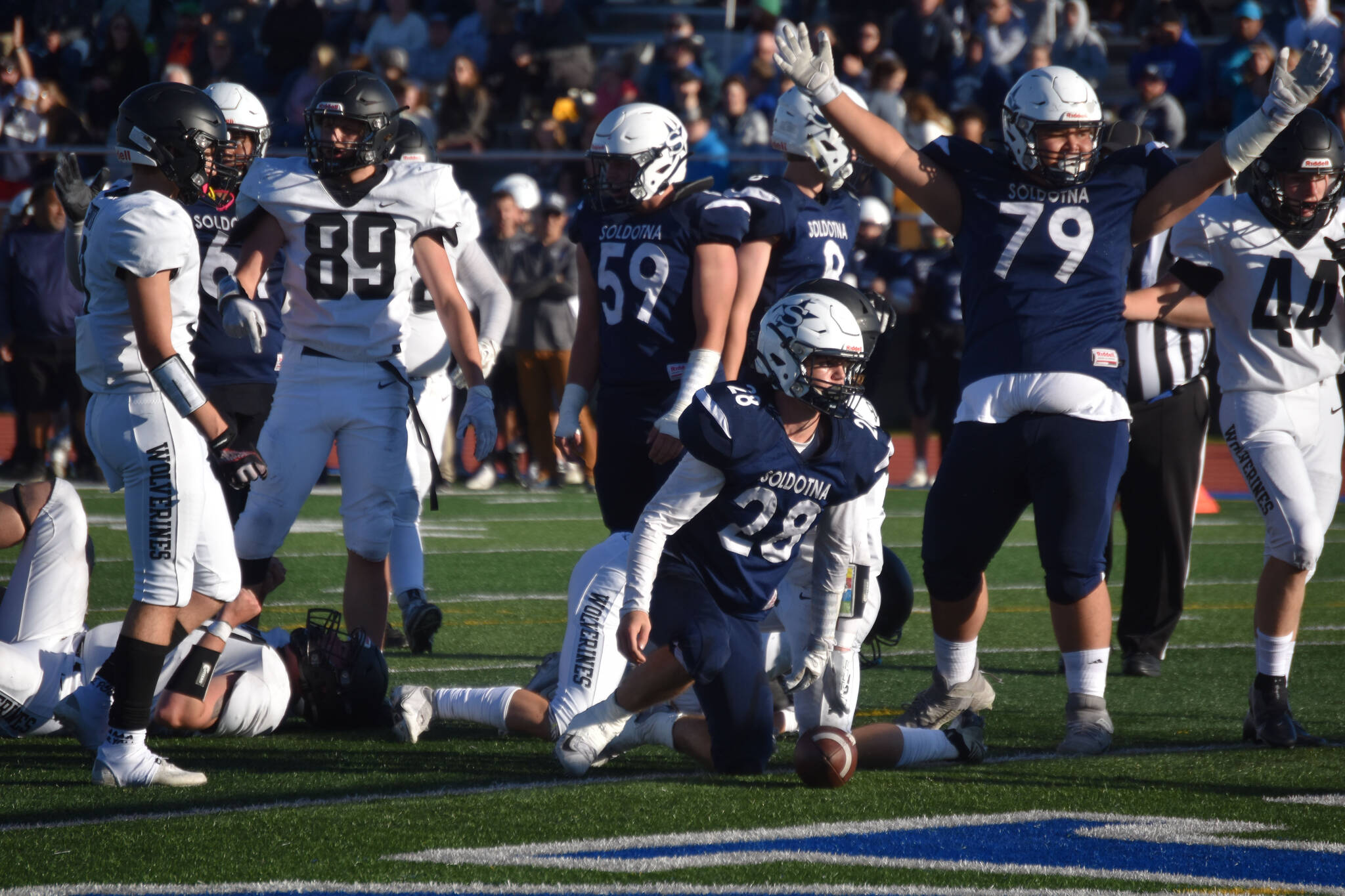 Wyatt Faircloth and Hokoa Montoya celebrate a touchdown at Justin Maile Field in Soldotna, Alaska, on Friday, Sept. 2, 2022. (Jake Dye/Peninsula Clarion)