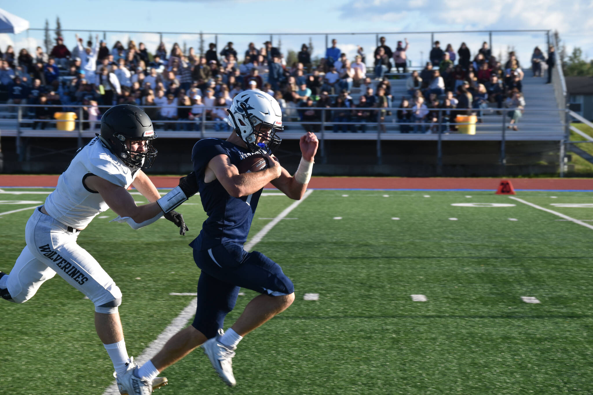 A South Anchorage defender tries to bring down Zac Buckbee during a run at Justin Maile Field in Soldotna, Alaska on Friday, Sept. 2, 2022. The run would be called back due to offsetting penalties. (Jake Dye/Peninsula Clarion)