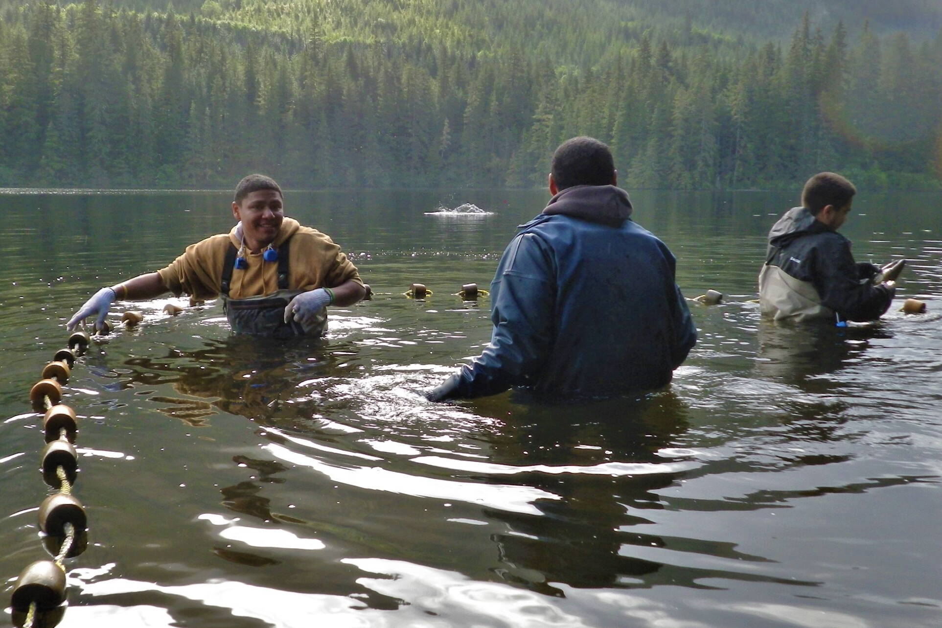 Fishers set out equipment a short distance from shore in the Tongass National Forest. The federal government on Friday announced it is awarding a $49 million grant to Alaska Mariculture Cluster, which is seeking to develop a $100 million a year sustainable seafood program in Southeast Alaska and other parts of the state. (U.S. Forest Service)