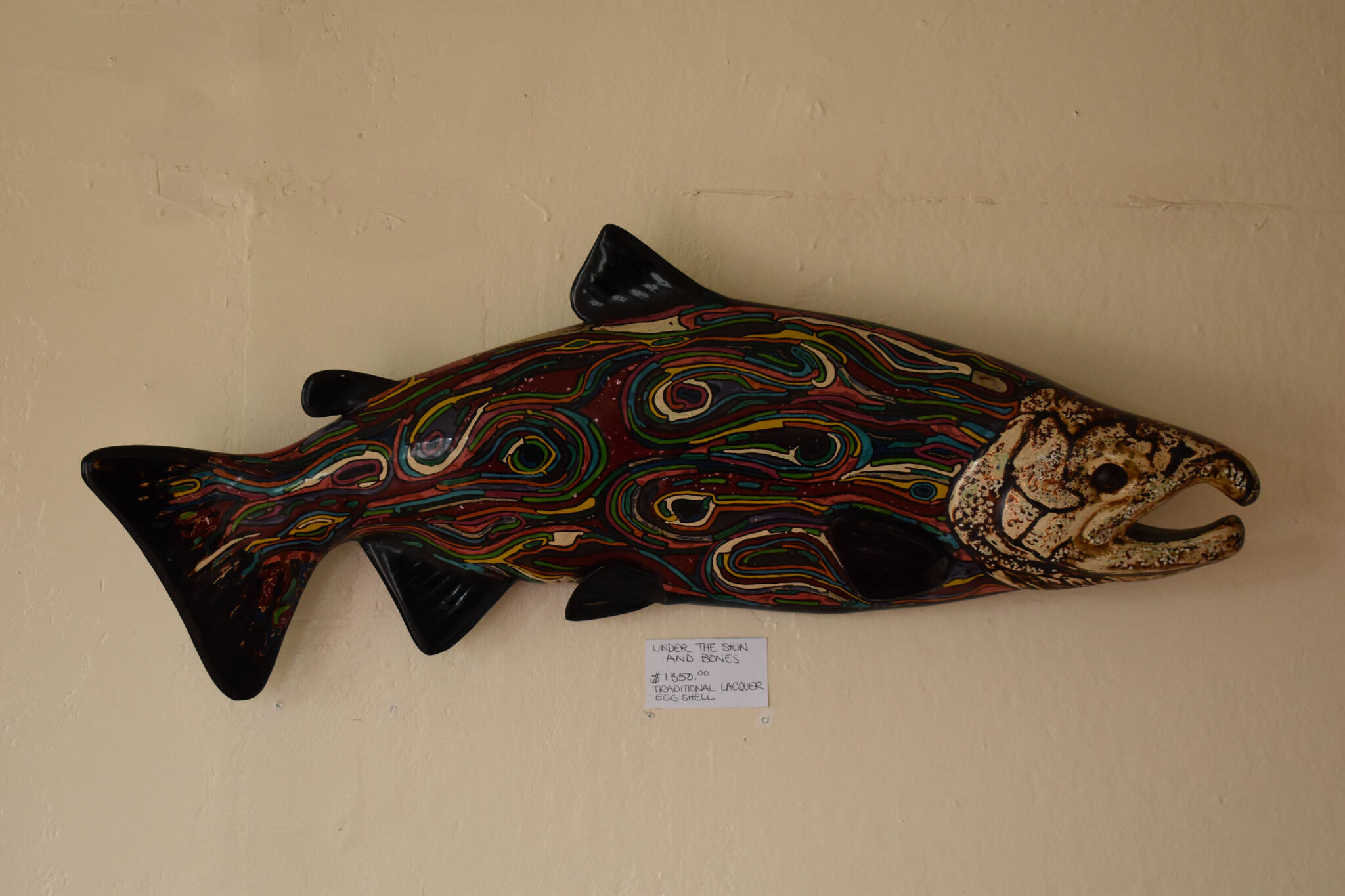 A lacquer sculpture of a salmon hangs on the walls of Kathy Matta’s gallery in Soldotna, Alaska on Wednesday, Sept. 7, 2022. (Jake Dye/Peninsula Clarion)