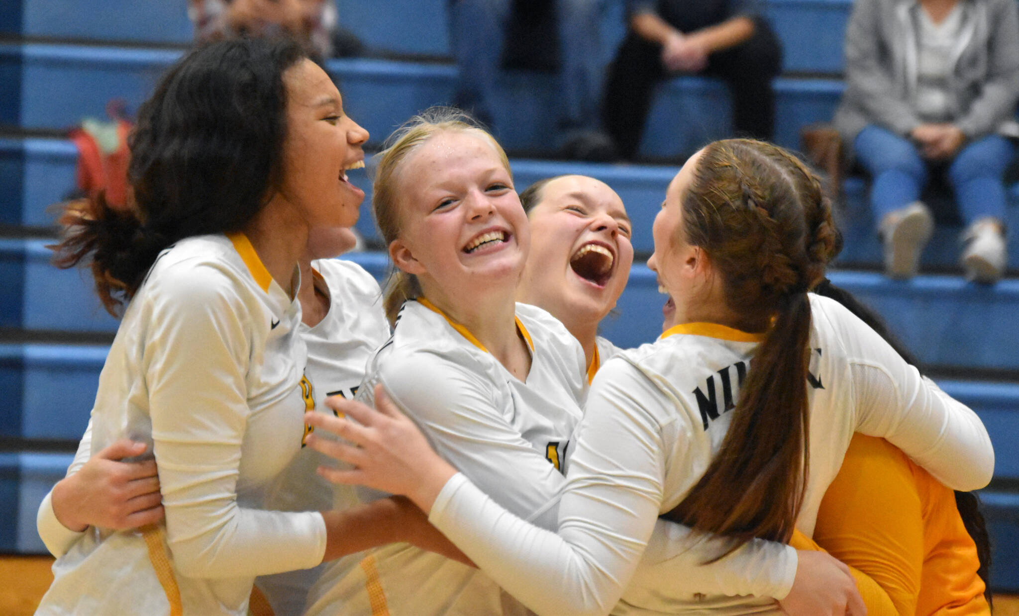 The Nikiski volleyball team celebrates after defeating Soldotna on Thursday, Sept. 8, 2022, at Soldotna High School in Soldotna, Alaska. (Photo by Jake Dye/Peninsula Clarion)
