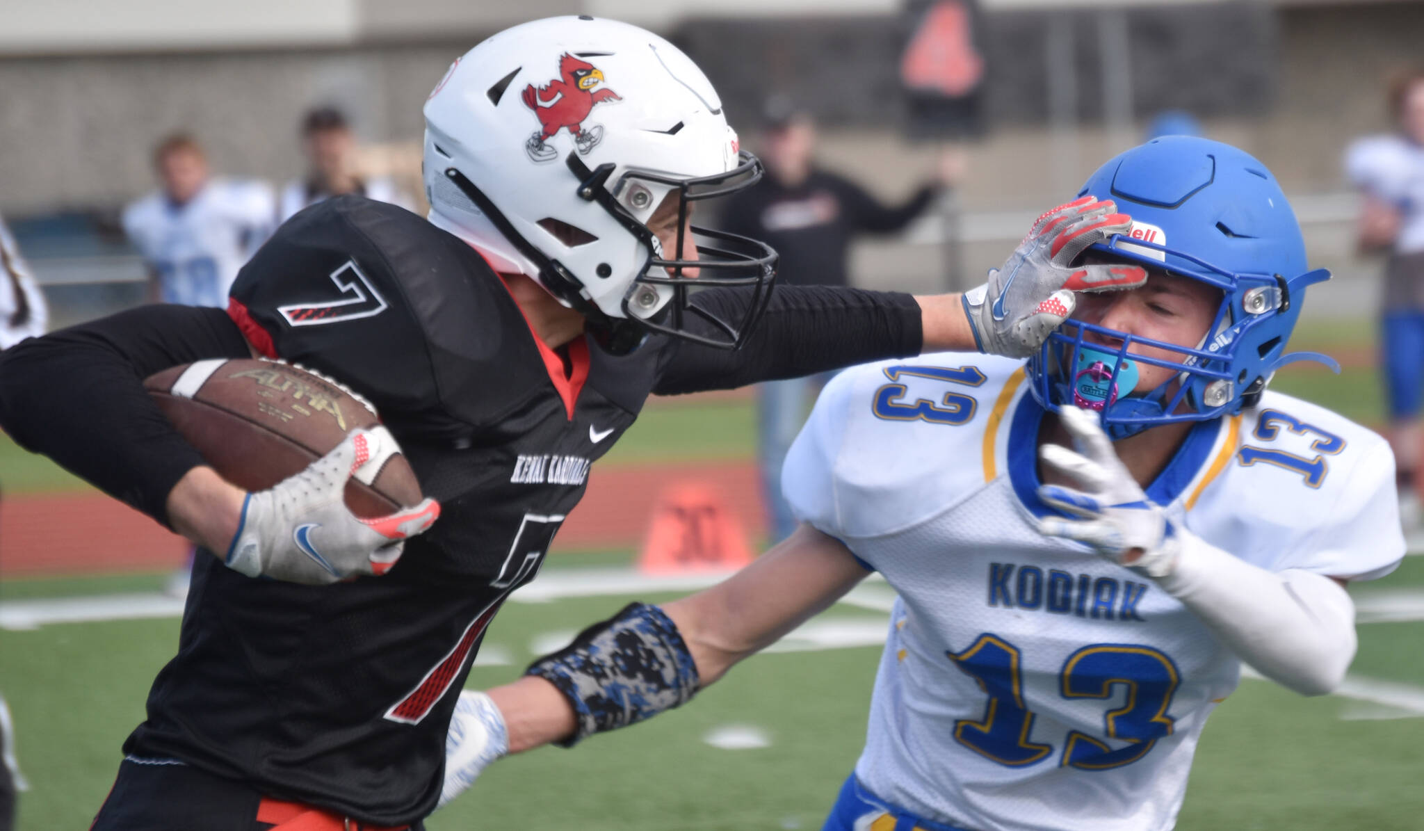 Kenai Central’s Luke Armstrong returns an interception against Kodiak’s Daniel Edwards on Saturday, Sept. 10, 2022, at Ed Hollier Field at Kenai Central High School in Kenai, Alaska. (Photo by Jeff Helminiak/Peninsula Clarion)