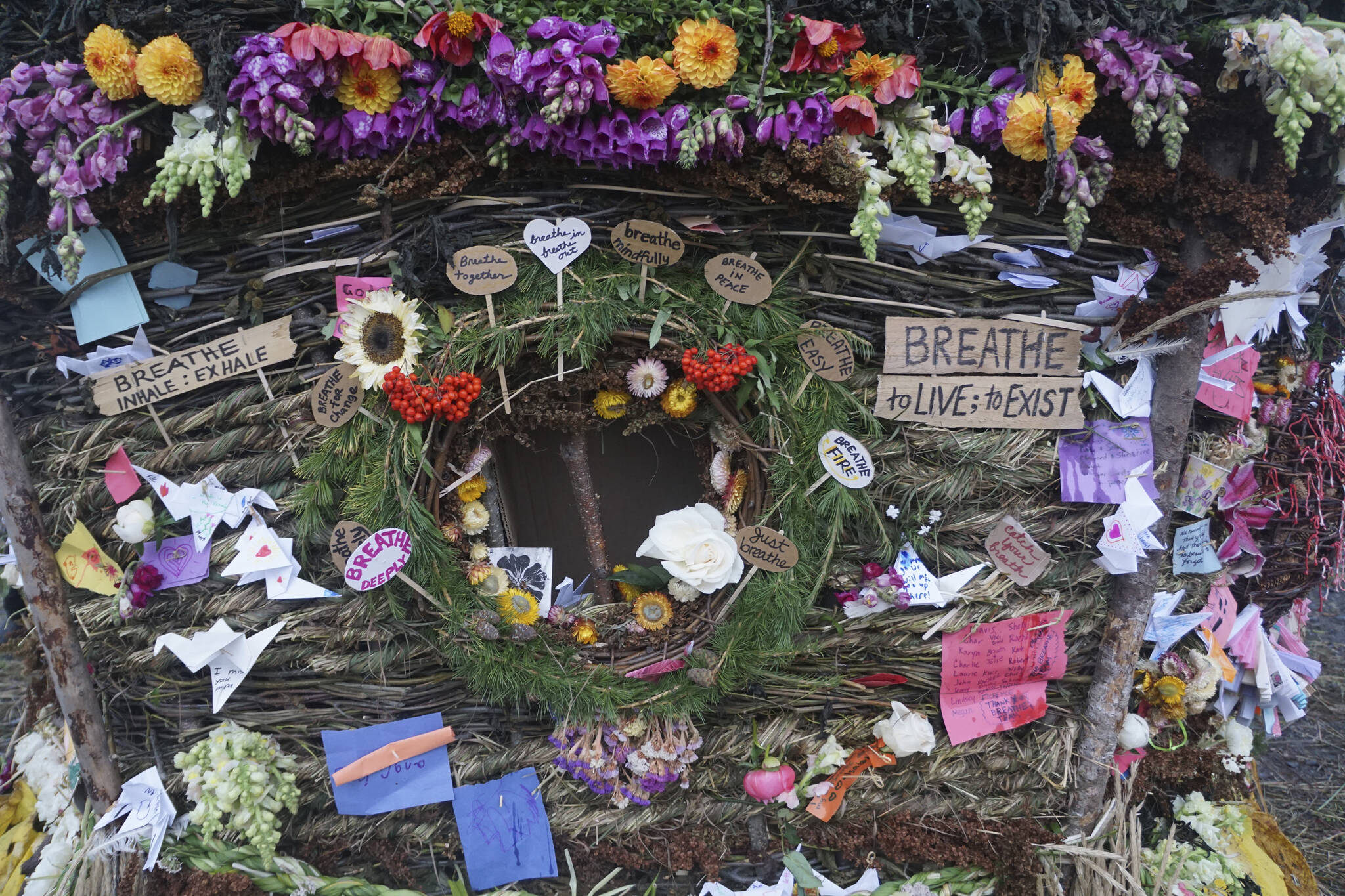 One of the portals in the 19th annual Burning Basket, “Breathe,” on Sunday, Sept. 11, 2022, at Mariner Park on the Homer Spit in Homer, Alaska. People placed notes expressing various sentiments inside the basket. (Photo by Michael Armstrong/Homer News)