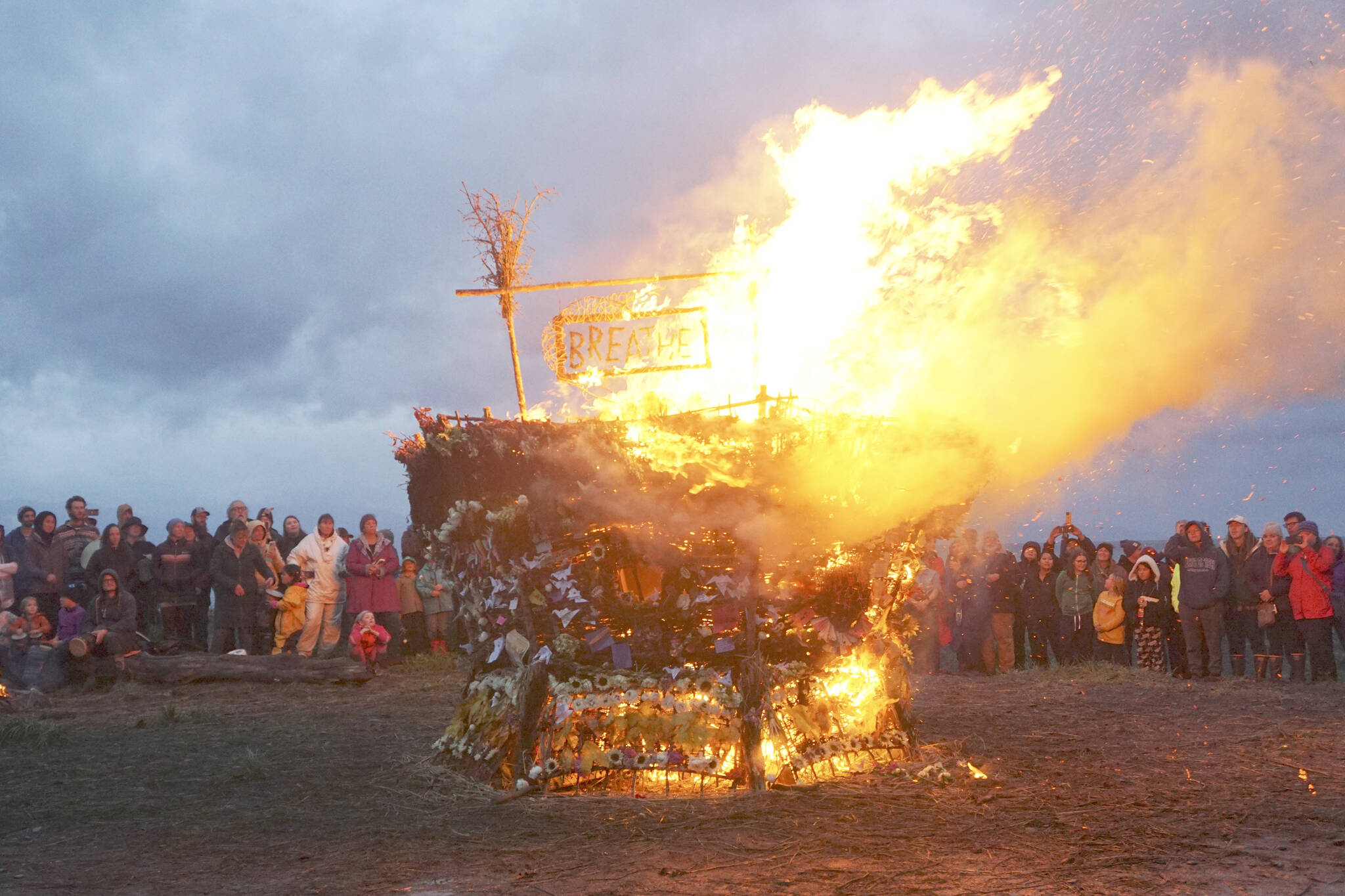 As about 200 people watch, the 19th annual Burning Basket, "Breathe," catches fire on Sunday, Sept. 11, 2022, at Mariner Park on the Homer Spit in Homer, Alaska. (Photo by Michael Armstrong/Homer News)