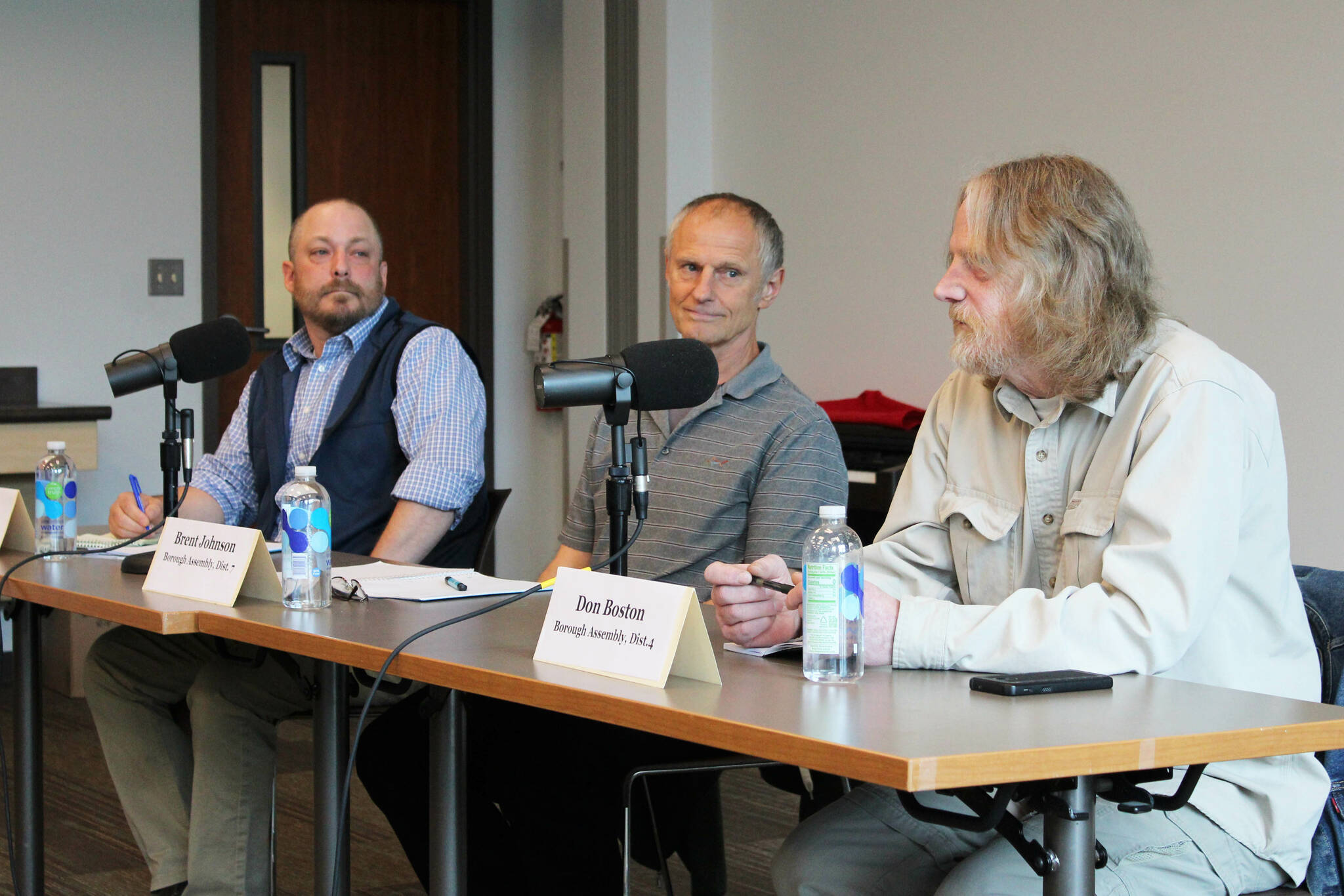 From left, Kenai Peninsula Borough assembly candidates Tyson Cox and Brent Johnson listen to Don Boston speak during a forum at the Soldotna Public Library on Monday, Sept. 12, 2022 in Soldotna, Alaska. (Ashlyn O’Hara/Peninsula Clarion)