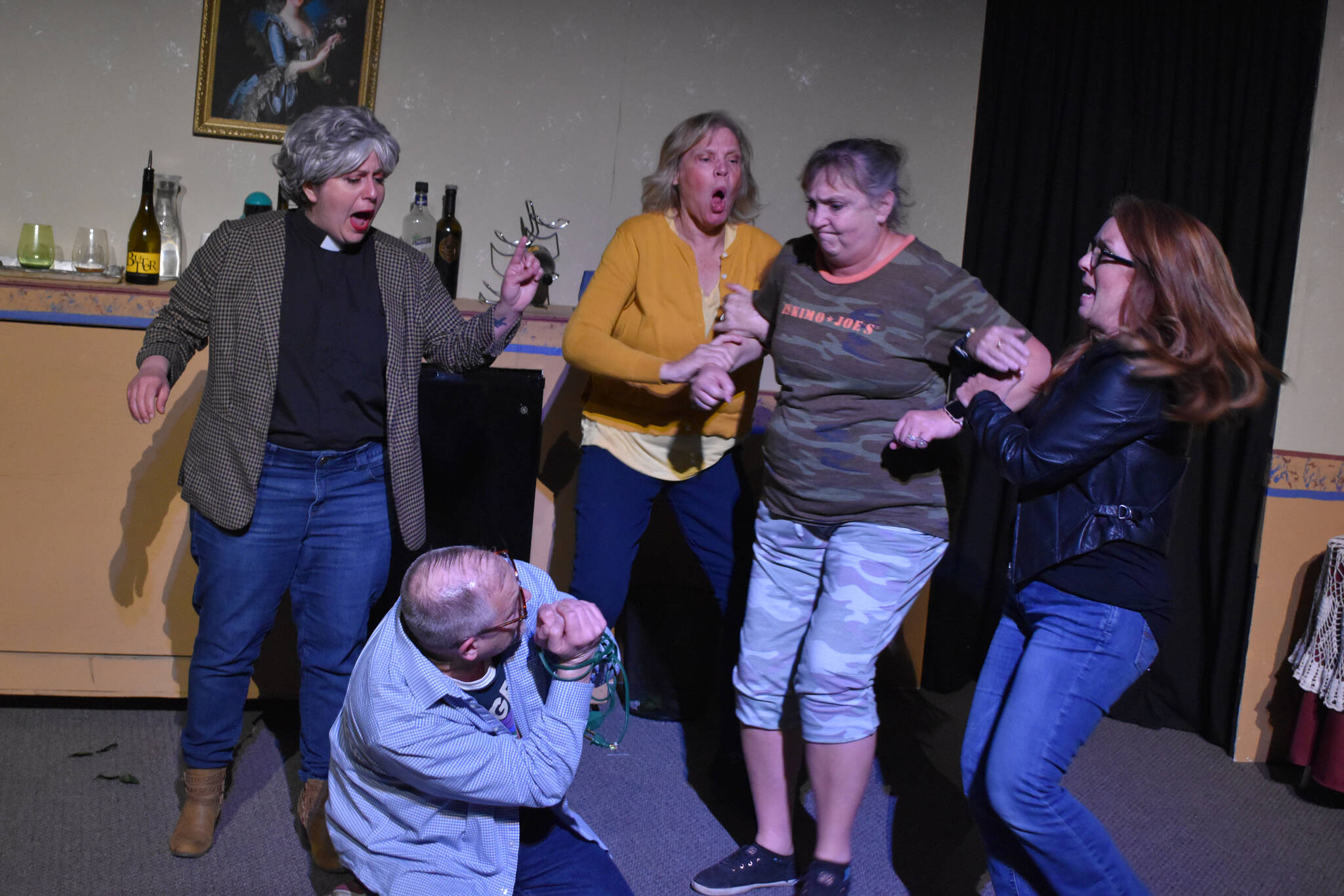 From left: Lacey Jane Brewster, Terri Zopf-Schoessler, Donna Shirnberg, Tracie Sanborn and Bill Taylor (center) rehearse “Menopause Made Me Do It” on Tuesday, Sept. 13, 2022, in Soldotna, Alaska. (Jake Dye/Peninsula Clarion)