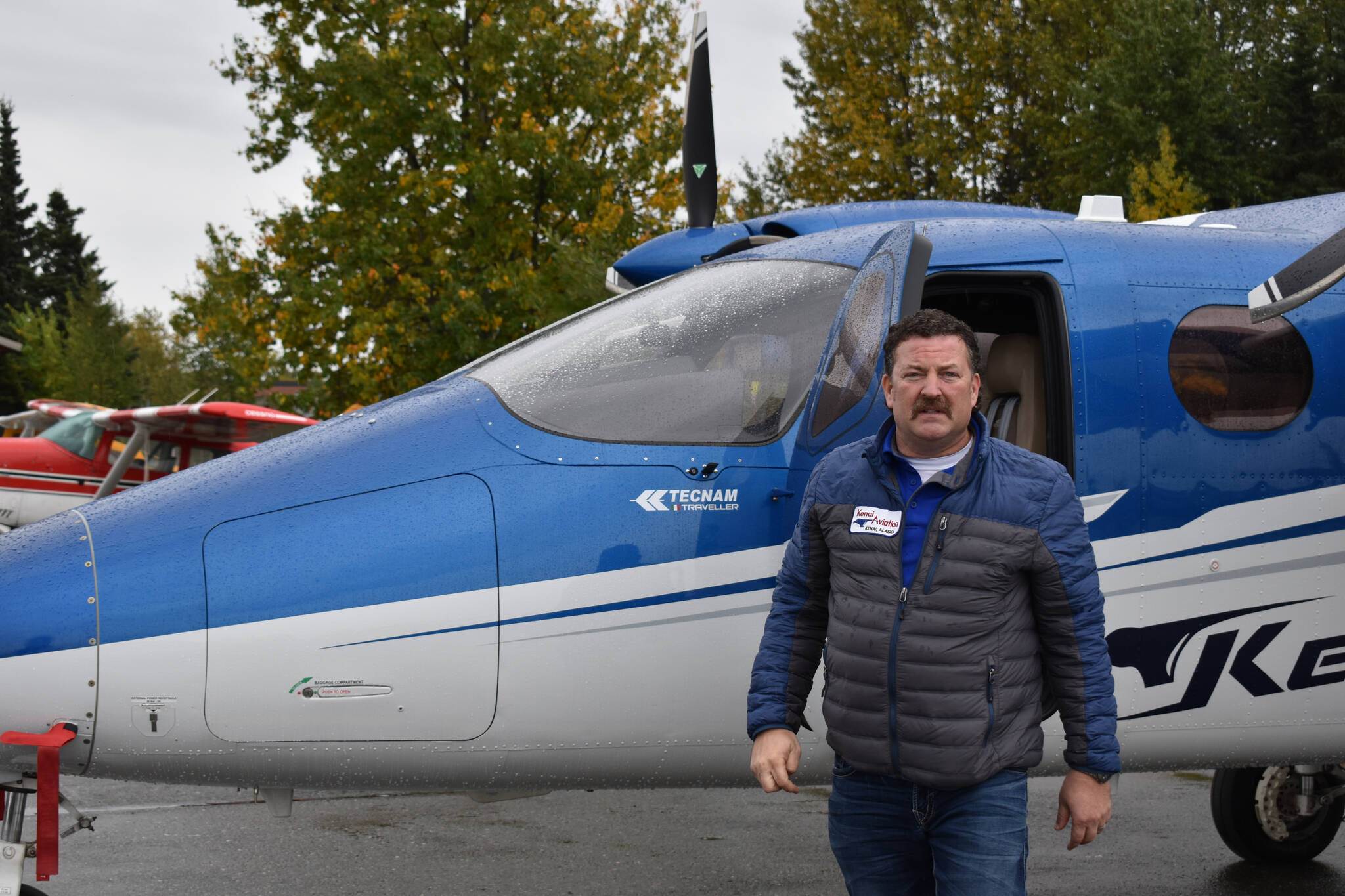 Joel Caldwell shows off the new Tecnam Traveller on Thursday, Sept. 15, 2022, in Kenai, Alaska. (Jake Dye/Peninsula Clarion)