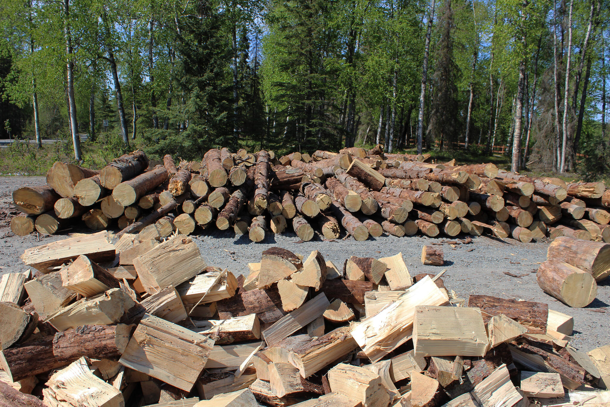Wood is piled near the entrance to Centennial Park on Thursday, May 26, 2022, in Soldotna, Alaska. (Ashlyn O’Hara/Peninsula Clarion)