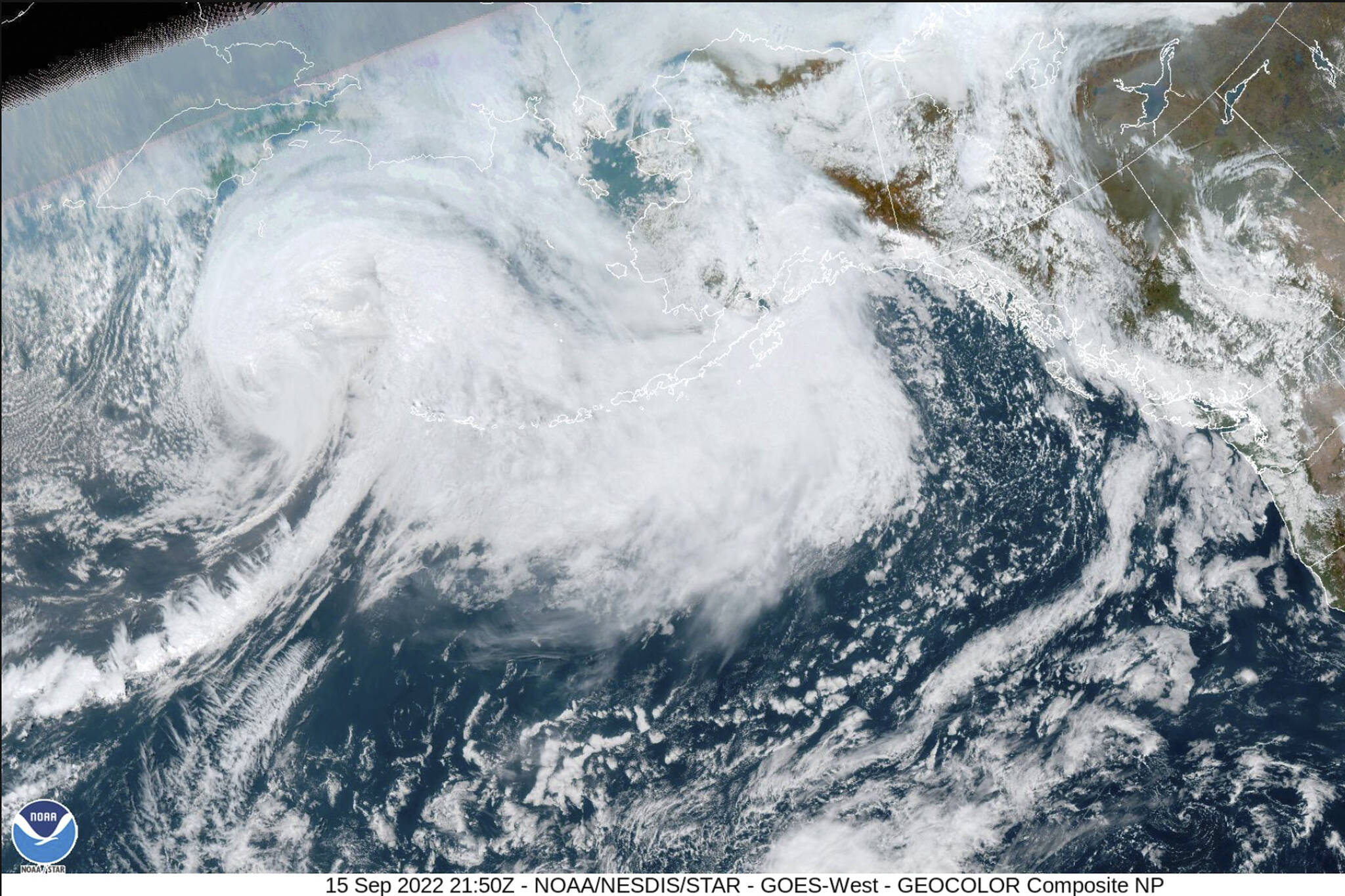 This image provided by the National Hurricane Center and Central Pacific Hurricane Center/National Oceanic and Atmospheric Administration shows a satellite view over Alaska, Thursday, Sept. 15, 2022. A vast swath of western Alaska could see flooding and high winds as the remnants of Typhoon Merbok move toward the Bering Sea region. The National Weather Service had in place coastal flood warnings, beginning Friday, spanning from parts of the Yukon Delta in southwest Alaska up to St. Lawrence Island in the Bering Sea and to the Bering Strait coast. (NOAA via AP)