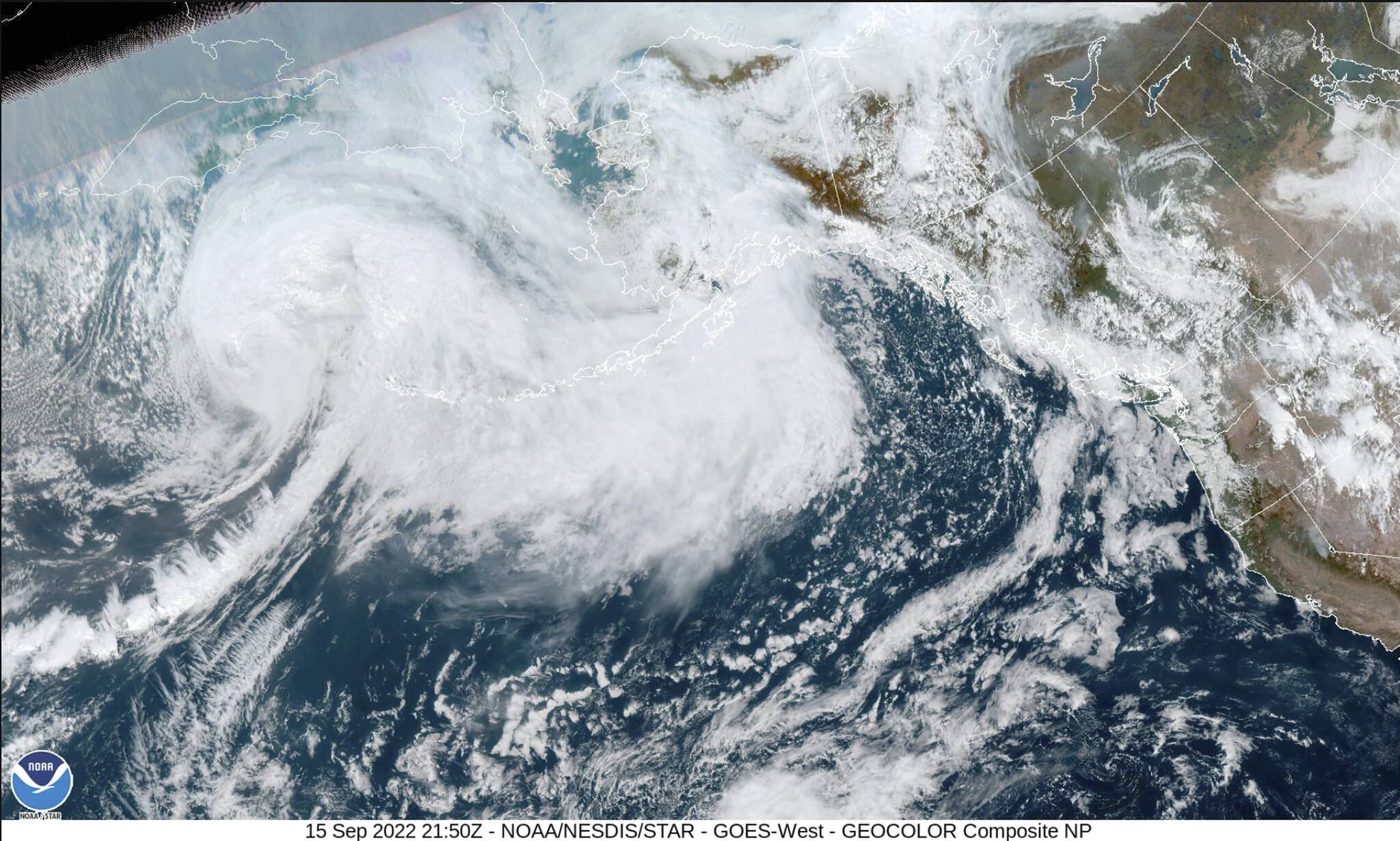 This image provided by the National Hurricane Center and Central Pacific Hurricane Center/National Oceanic and Atmospheric Administration shows a satellite view over Alaska, Thursday, Sept. 15, 2022. A vast swath of western Alaska could see flooding and high winds as the remnants of Typhoon Merbok move toward the Bering Sea region. The National Weather Service had in place coastal flood warnings, beginning Friday, spanning from parts of the Yukon Delta in southwest Alaska up to St. Lawrence Island in the Bering Sea and to the Bering Strait coast. (NOAA via AP)