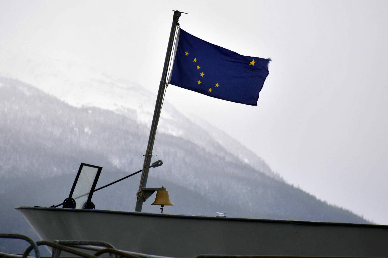 This February 2020 file photo shows the Alaska state flag on the bow of the Matanuska at the Auke Bay Ferry Terminal. (Peter Segall / Juneau Empire file)