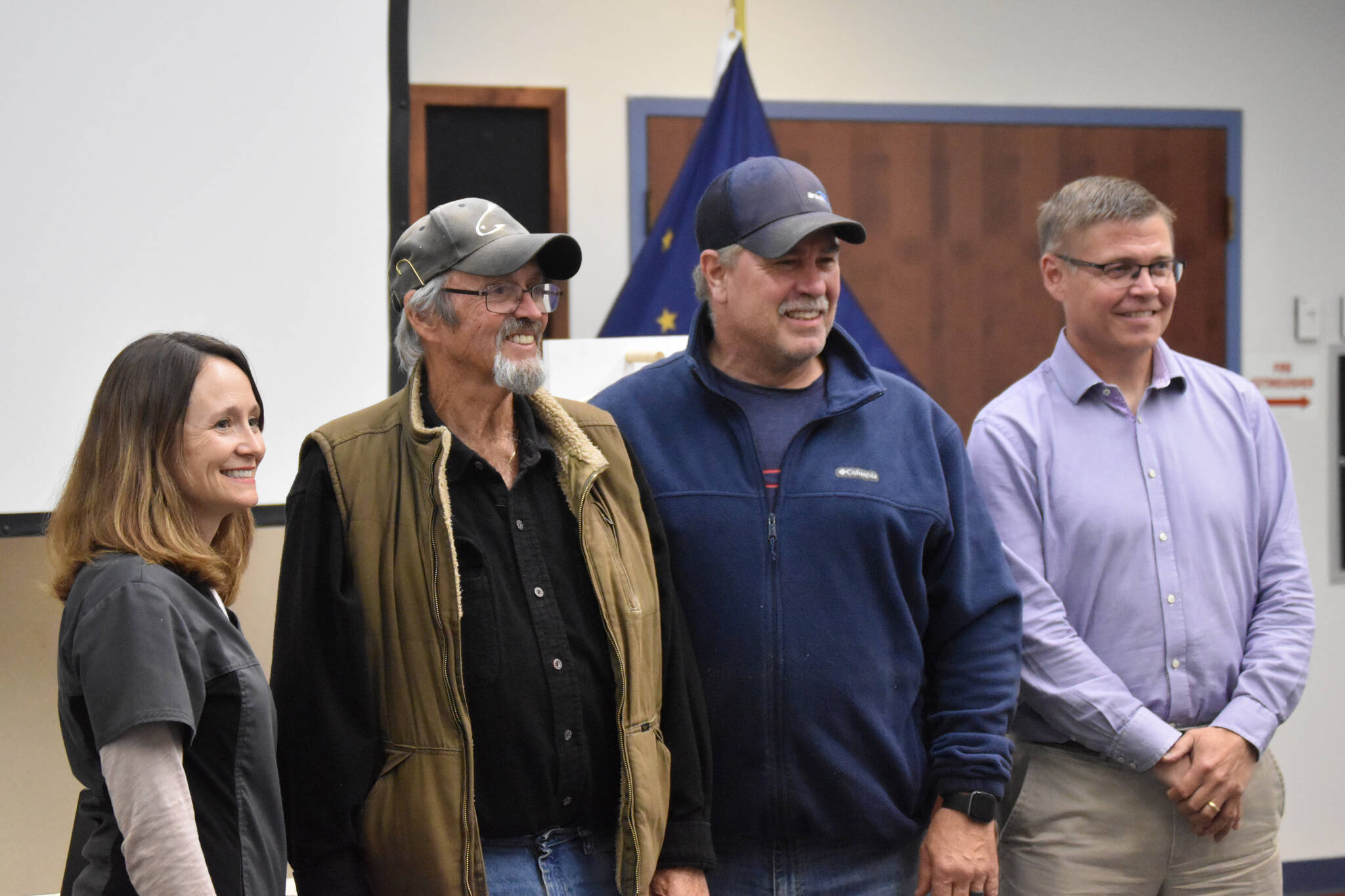 Dr. Katy Rice, Ronald Duval, Brian Gabriel and Paul Ostrander stand for photos at the closing ceremony of the Kenai Silver Salmon Derby on Monday, Sept. 19, 2022, in Kenai, Alaska. Duval won the adult division of the derby. (Jake Dye/Peninsula Clarion)