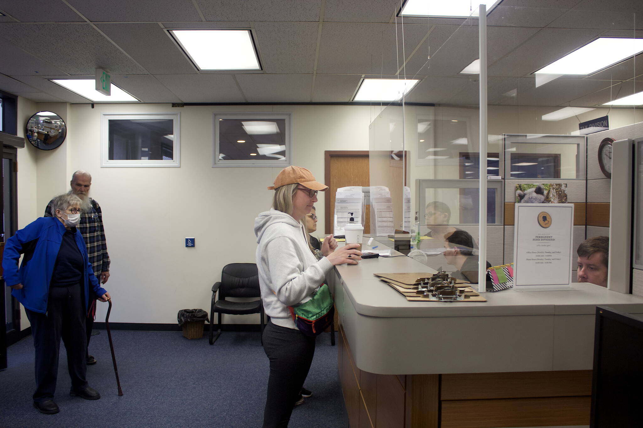 Mark Sabbatini / Juneau Empire
Kelsey Martin asks about the status of her son’s Permanent Fund Dividend check after arriving first at Juneau’s PFD office in the State Office Building on Tuesday, the first day direct deposit payments of the $3,284 dividends are being credited. Eligible residents who did not receive direct deposits will be paid by checks that will be mailed starting Oct. 6.