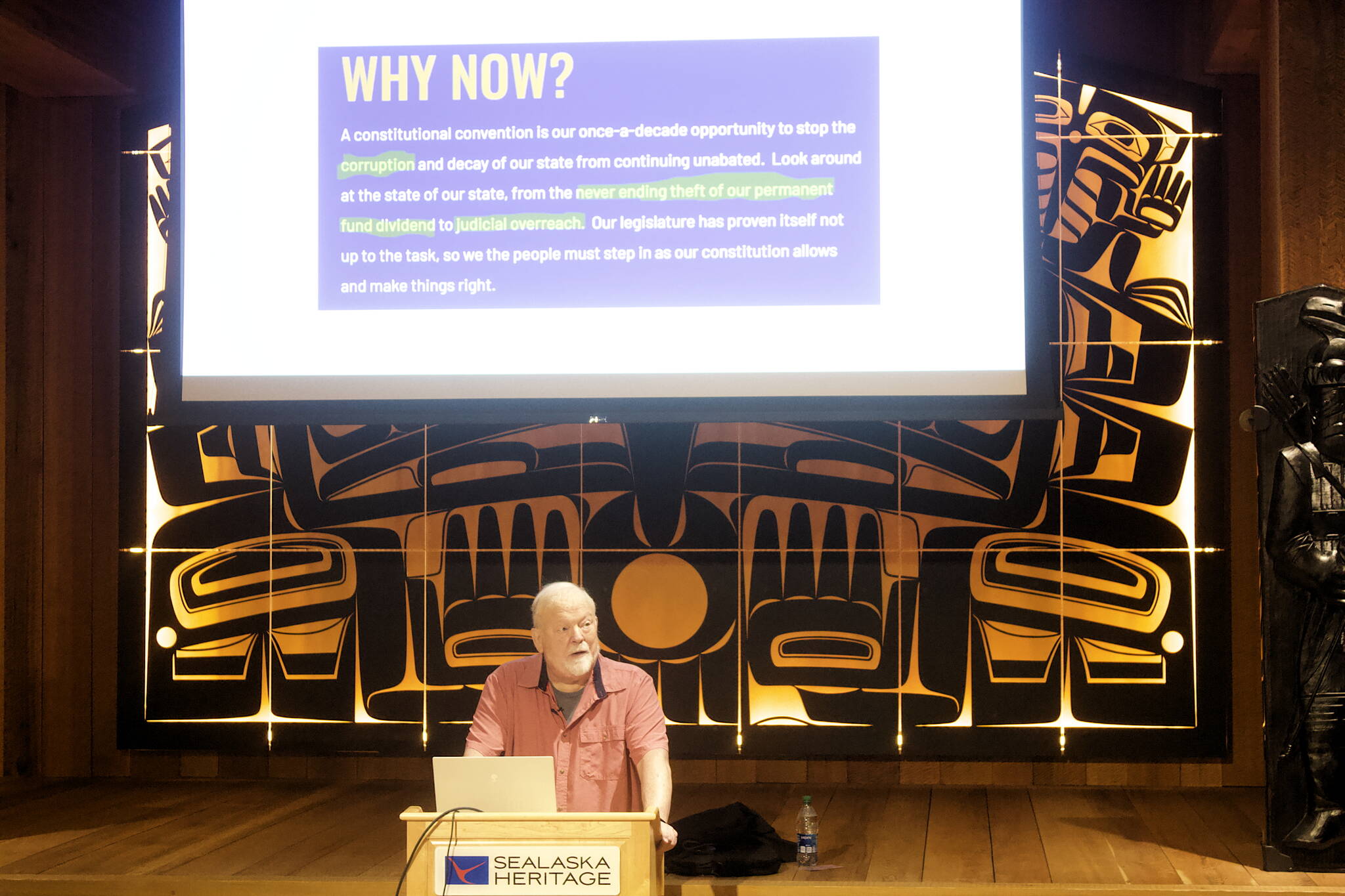 Former Juneau Mayor Bruce Botelho displays a slide showing some of the arguments being made for voting in favor of a state constitutional convention in the November general election while explaining the reasons he opposes such a convention during a lecture Tuesday at the Walter Soboleff Building. He said voters have rejected a convention by large margins almost every time it has come up every ten years since statehood, but a current mood of higher political distrust in government nationwide means there appears to be a higher likelihood of passage this year. (Mark Sabbatini / Juneau Empire)