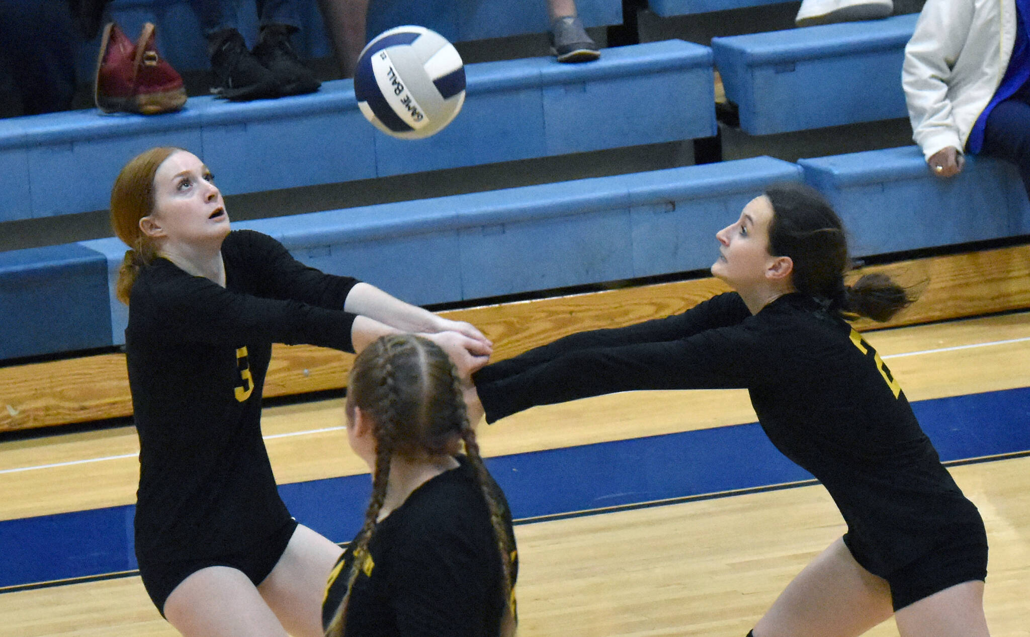 Seward’s Robin Cronin and Olive Sayler combine to dig up a ball against Soldotna on Tuesday, Sept. 20, 2022, at Soldotna High School in Soldotna, Alaska. (Photo by Jeff Helminiak/Peninsula Clarion)