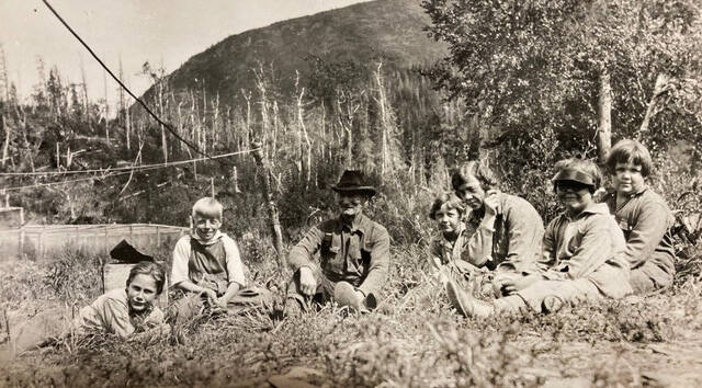 Photo courtesy of the Mona Painter Collection 
A group of guests relax near Luther W. Bishop’s lodge on Lower Russian Lake in about 1930.