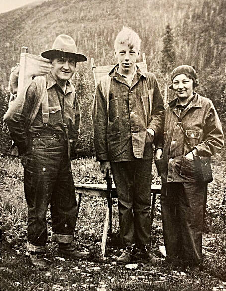 Photo courtesy of the Mona Painter Collection 
Teenager Nick Lean, of Cooper Landing (center) poses with friends near Luther W. Bishop’s lodge near the outlet of Lower Russian Lake.