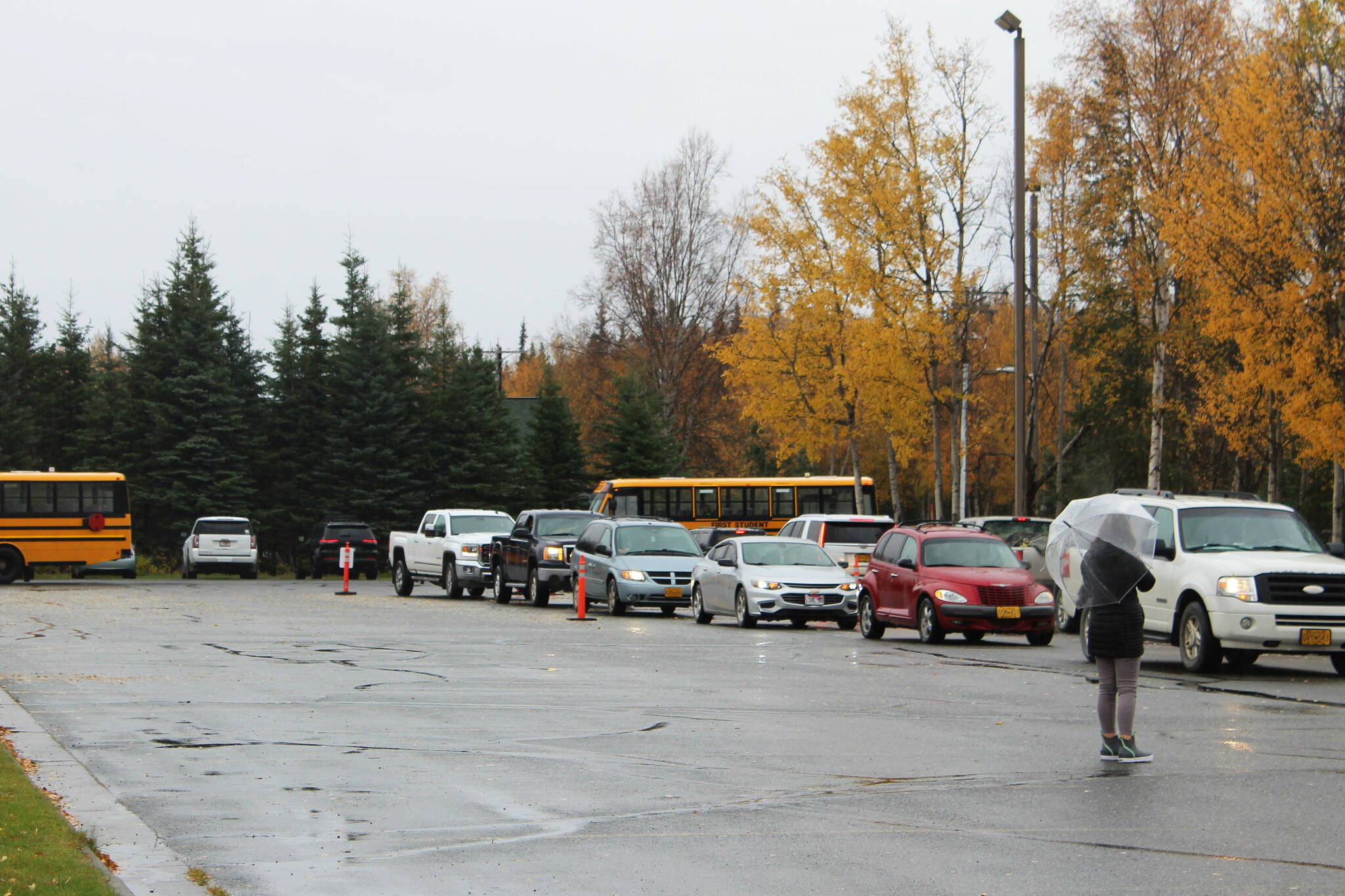 Staff help direct student pick up traffic at Mountain View Elementary School on Thursday, Sept. 29, 2022 in Kenai, Alaska. (Ashlyn O'Hara/Peninsula Clarion)