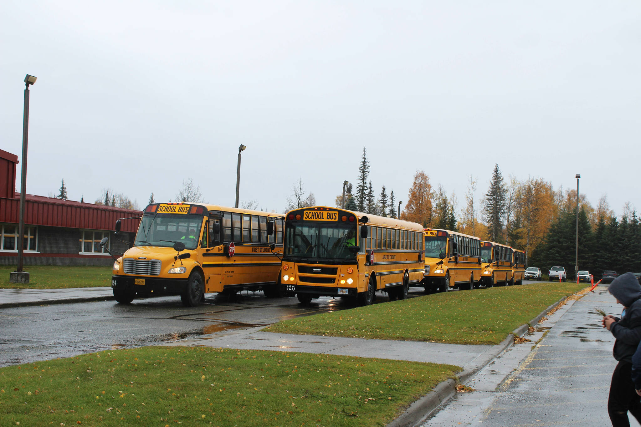 Buses line up ahead of dismissal at Mountain View Elementary School on Thursday, September 29, 2022, in Kenai, Alaska. A bond package up for consideration by Kenai Peninsula Borough voters on Oct. 4 would fund improvements to the school’s traffic flow. (Ashlyn O’Hara/Peninsula Clarion)