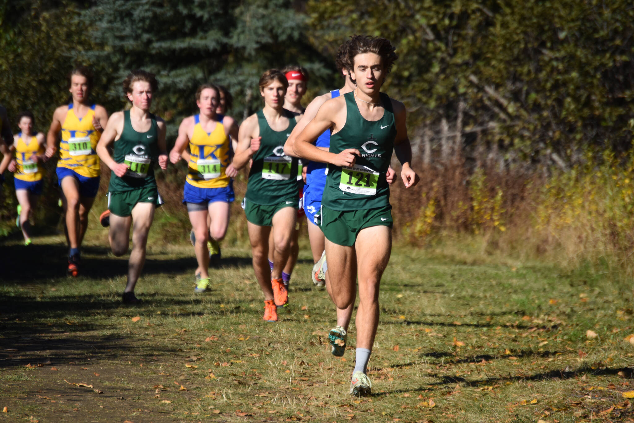 Colony’s Matthew Rongitsch leads the Region 3/Division I boys race on Saturday, Oct. 1, 2022 just outside of Tsalteshi Trails in Soldotna, Alaska. (Jake Dye/Peninsula Clarion)