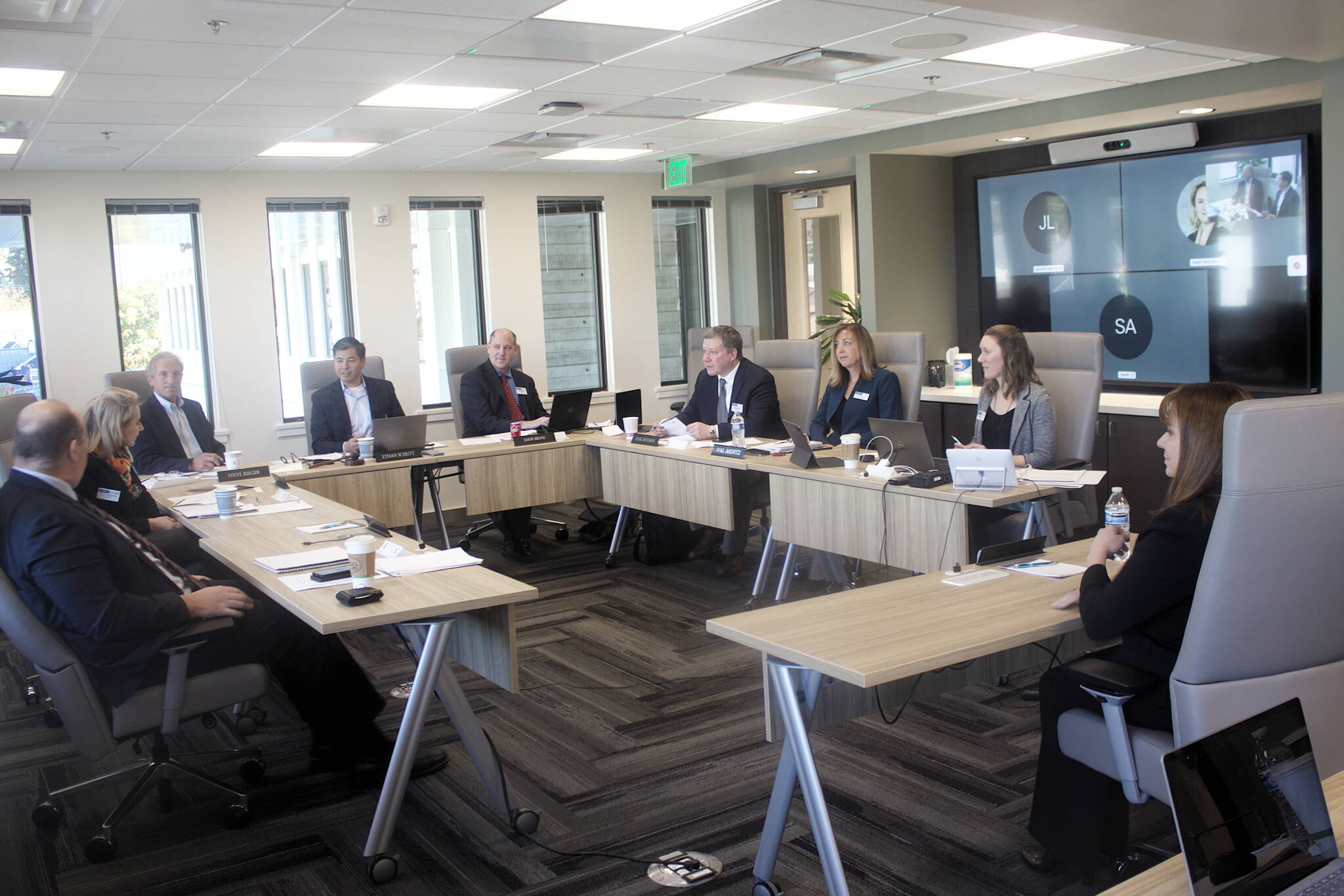 Melanie Hardin, right, greets the Alaska Permanent Fund Corp.’s Board of Trustees before her interview for the APFC’s executive director’s job Monday, Oct. 3, 2022, in Juneau, (Mark Sabbatini / Juneau Empire)