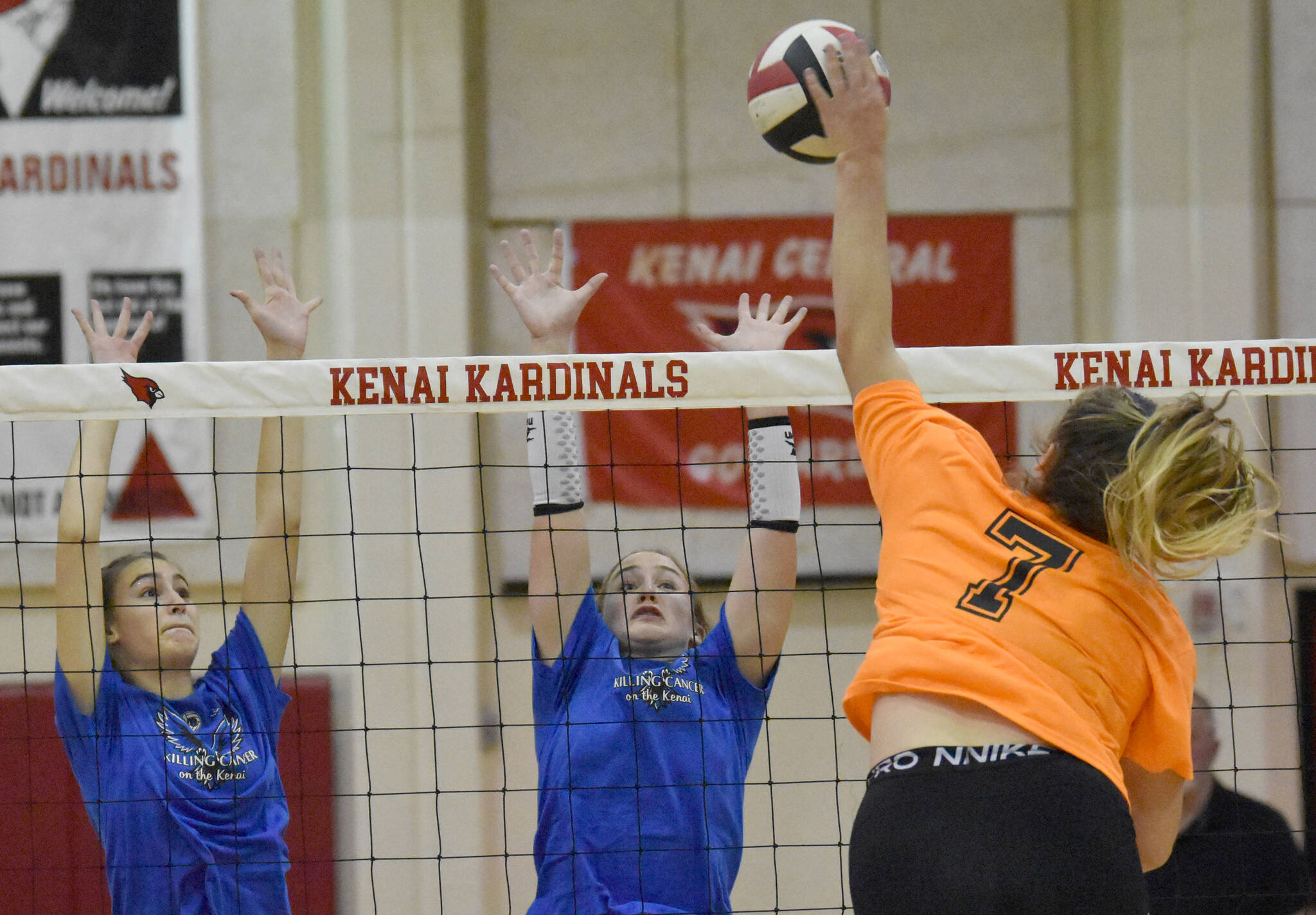 Soldotna’s Hallie Fischer and Sadie Lane set up a block on Kenai Central’s Emma Beck on Tuesday, Sept. 4, 2022, at Kenai Central High School in Kenai, Alaska. (Photo by Jeff Helminiak/Peninsula Clarion)