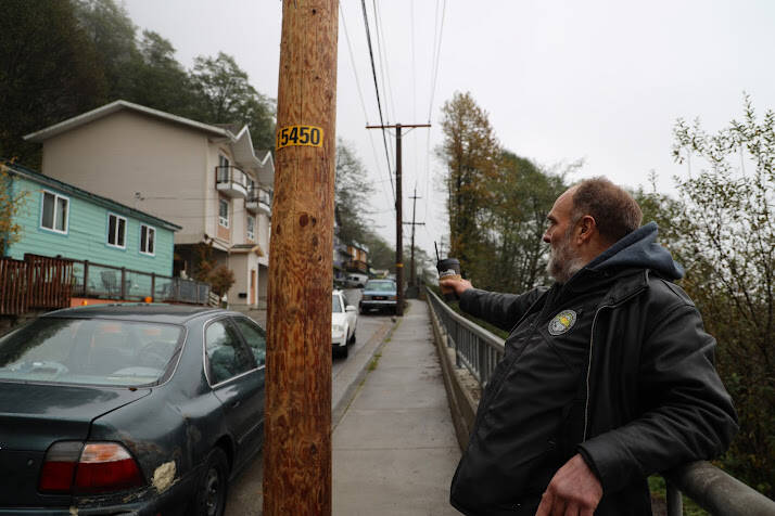 Clarise Larson/ Juneau Empire
Lionel Brown points down Gastineau Avenue on Thursday morning. He said it was a normal routine to walk down the street most mornings, but had to change his route for a while debris cleanup was underway.