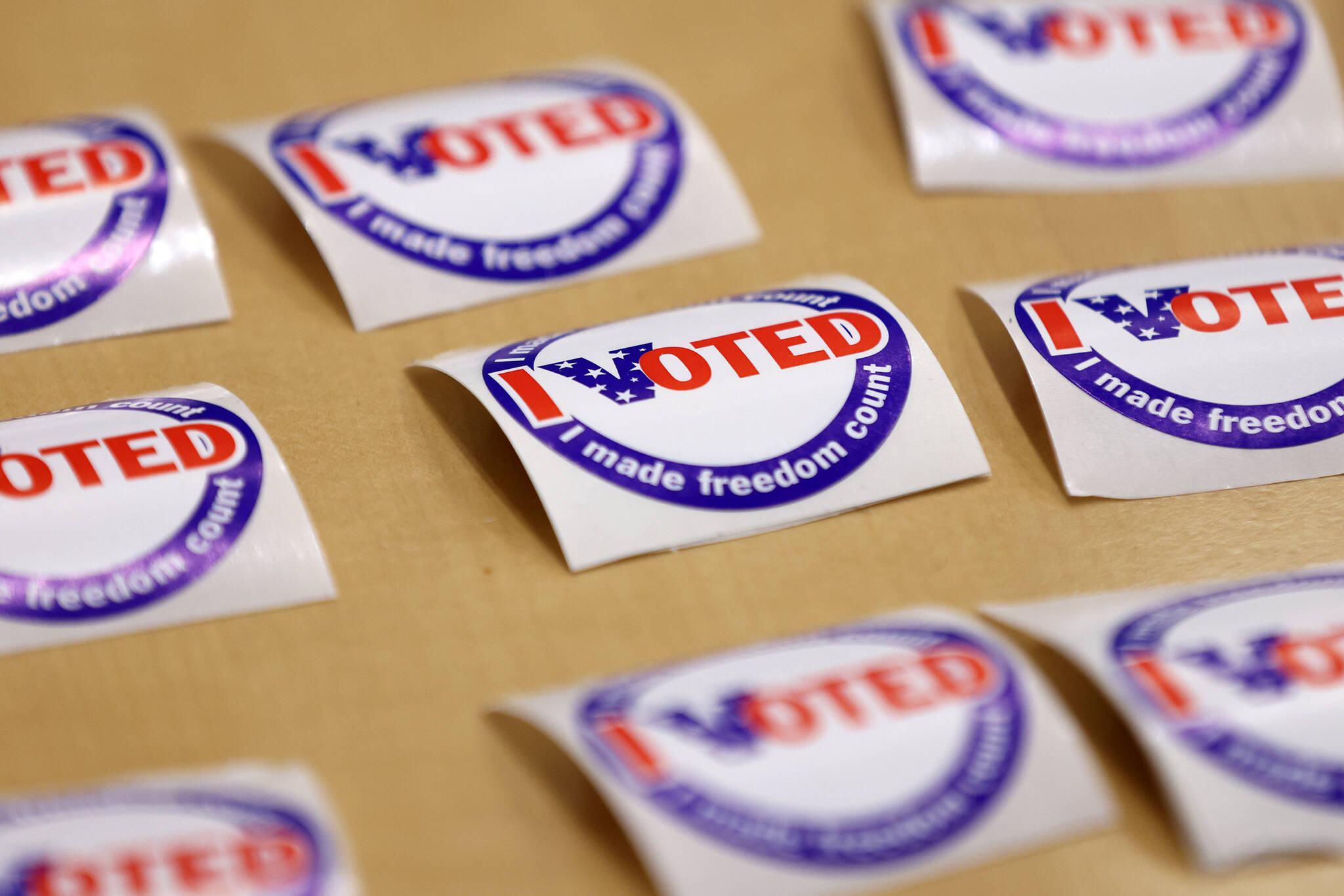 An array of “I Voted” stickers lie on a table at the Mendenhall Valley Public Library on Tuesday, Oct. 4, 2022, in Juneau, Alaska. (Ben Hohenstatt / Juneau Empire)