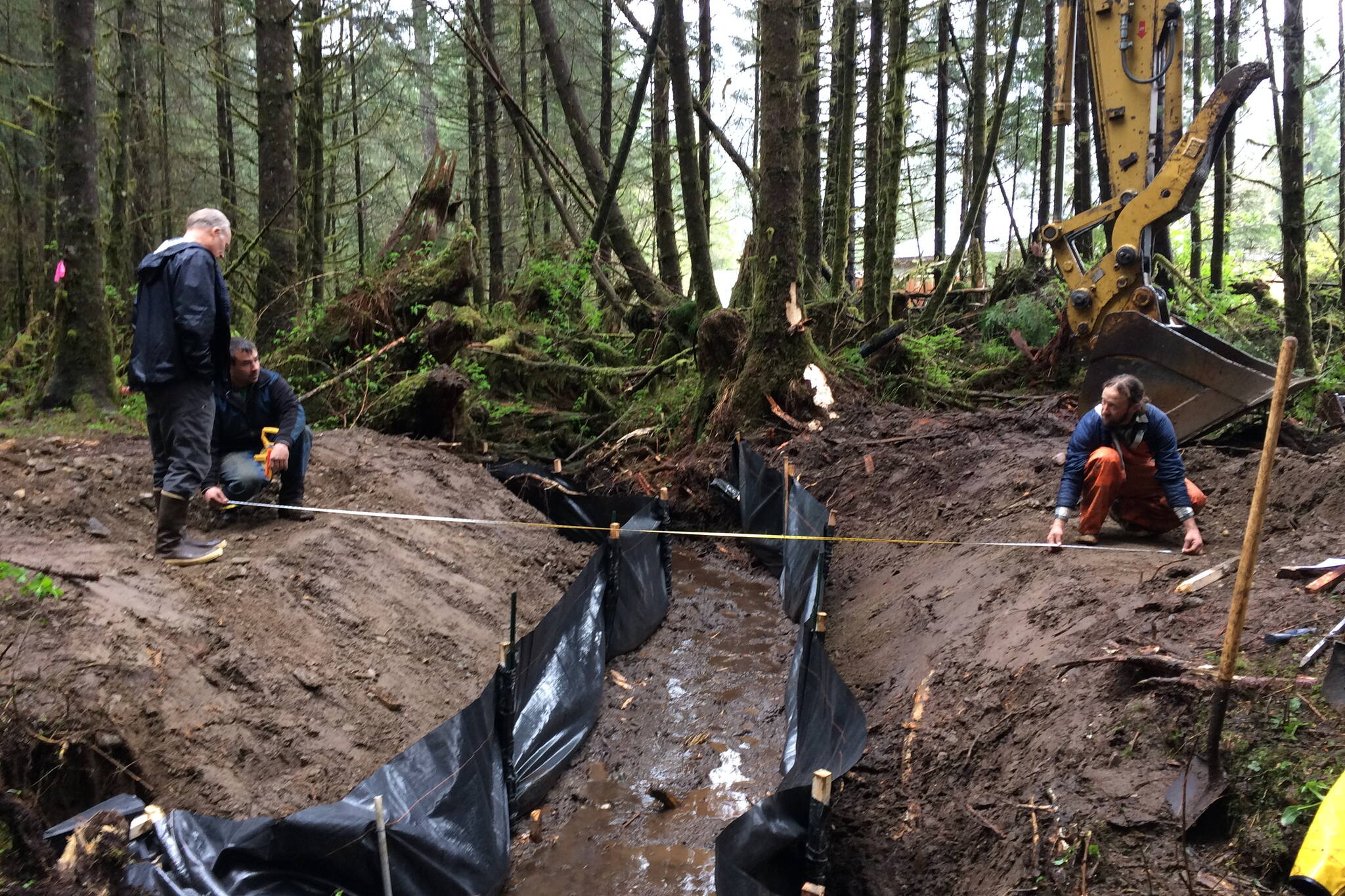 Courtesy Photo / Southeast Alaska Watershed Coalition
Workers replace a failed log culvert with a small foot bridge over Switzer Creek in a project funded by the U.S. Fish and Wildlife Service, with some materials provided by the Alaskan Brewing Company. The federal government on Thursday announced an additional $1 billion in grants is being made available during the next five years for culvert repairs in areas where fish passage is blocked.