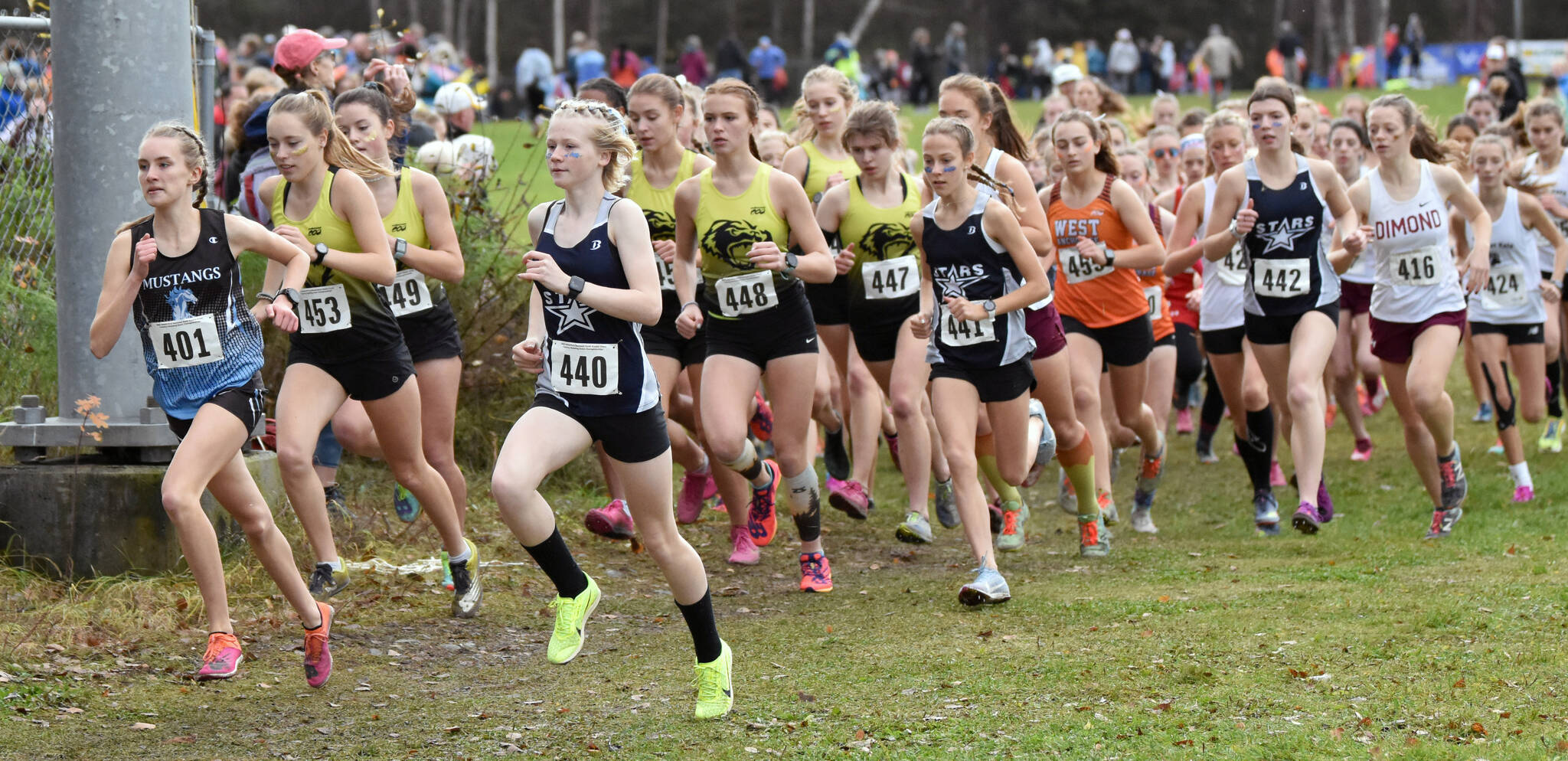 Chugiak’s Campbell Peterson and Soldotna’s Sophia Jedlicki lead the Division I girls race at the state cross-country meet Saturday, Oct. 8, 2022, at Bartlett High School in Anchorage, Alaska. (Photo by Jeff Helminiak/Peninsula Clarion)