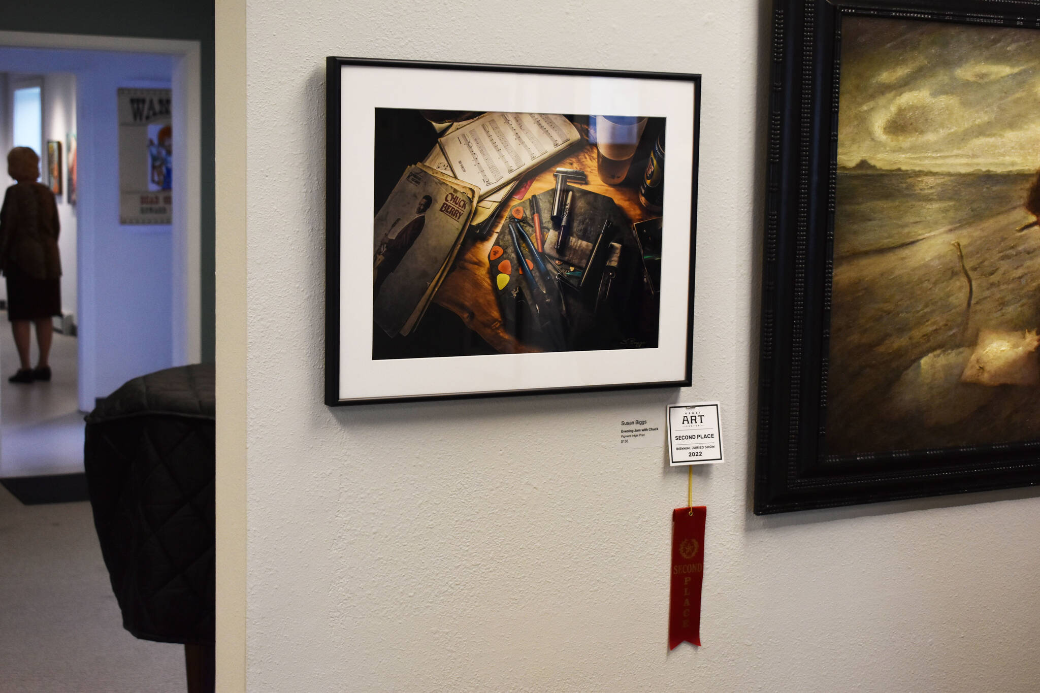 “Evening Jam with Chuck” by Susan Biggs, hangs with its second place ribbon during the opening reception of the Kenai Art Center Biennial Juried Show on Thursday, Oct. 6, 2022, at the Kenai Art Center in Kenai, Alaska. (Jake Dye/Peninsula Clarion)