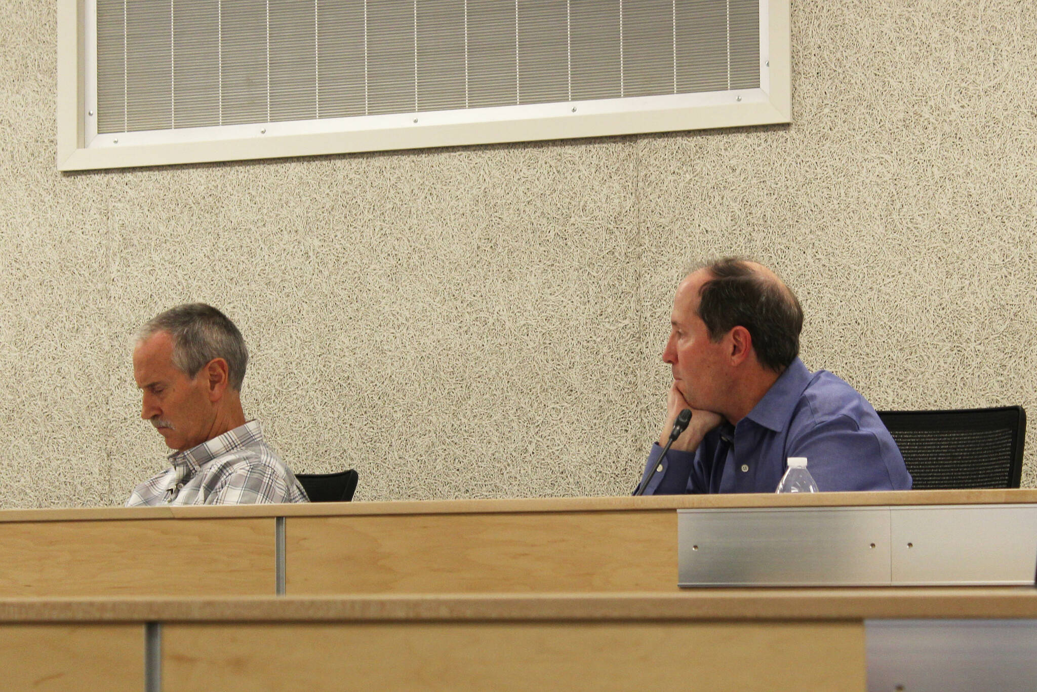 Kenai Peninsula Borough Mayor Mike Navarre, right, and his chief of staff, Max Best, participate in an assembly meeting on Tuesday, Oct. 11, 2022, in Soldotna, Alaska. The meeting was Navarre’s first as mayor since being appointed last month. (Ashlyn O’Hara/Peninsula Clarion)