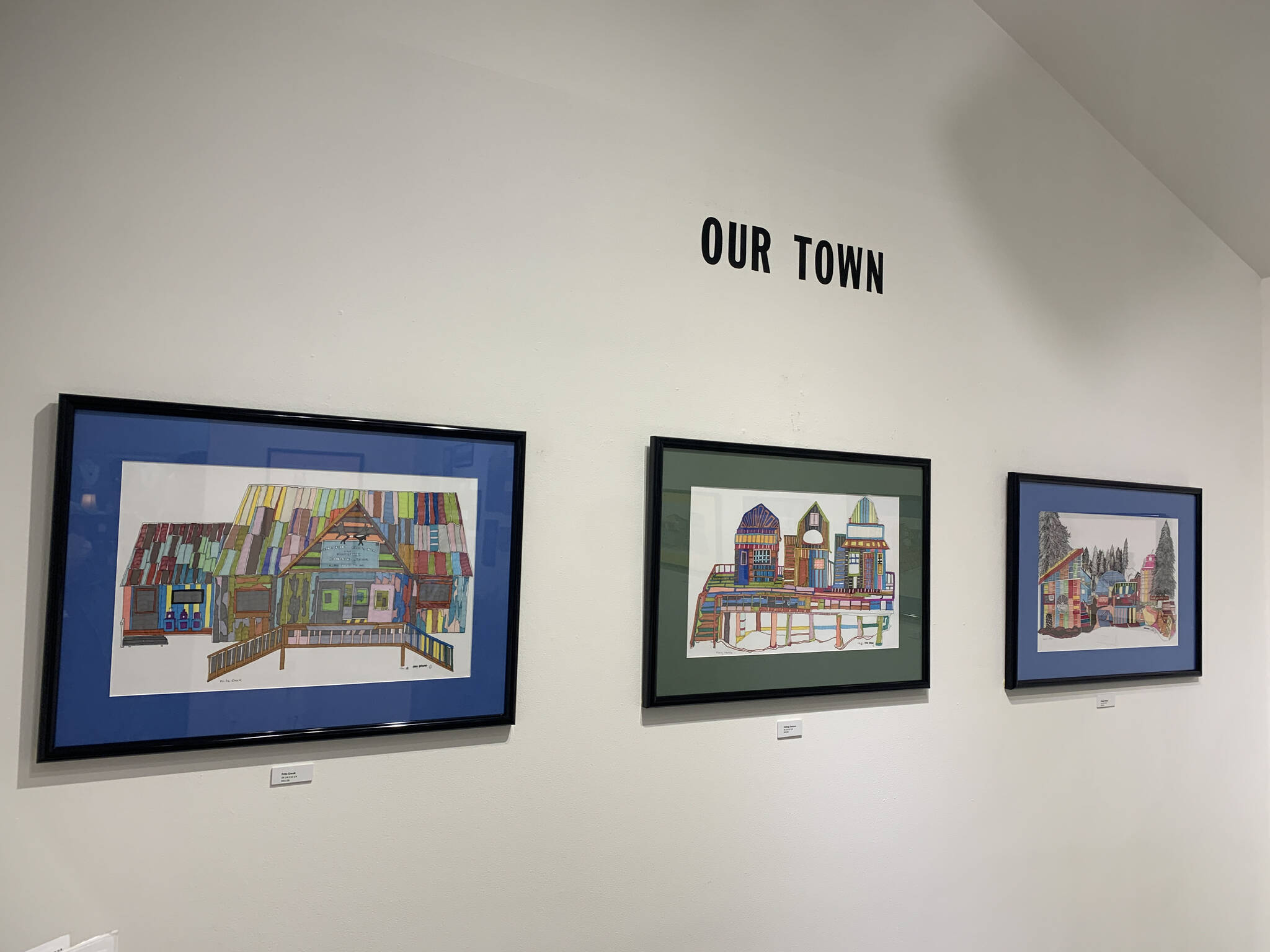 Original colored drawings in the Our Town exhibit at Fireweed Gallery are on display through December. (Photo by Christina Whiting/Homer News)