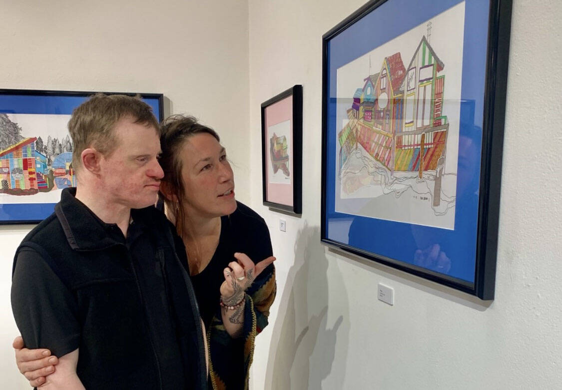 Artists Erik Behnke and Teresa Aldridge at their First Friday opening of Our Town, Oct. 7, 2022, in Homer, Alaska. (Photo by Christina Whiting/Homer News)