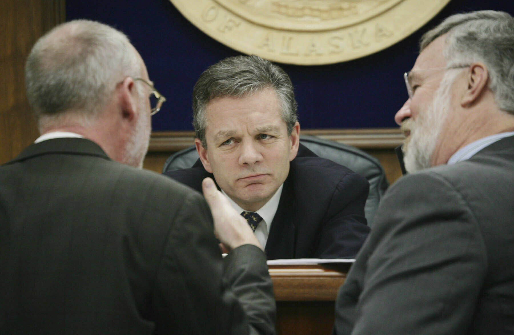 Then-Alaska State Senate President Ben Stevens, R-Anchorage, center, and Sen. Gary Stevens, R-Kodiak right, listen to Sen. Kim Elton, D-Juneau, May 3, 2006, during a Senate floor session at the Capitol in Juneau, Alaska. Ben Stevens, a former Alaska Senate president and a son of the late U.S. Sen. Ted Stevens, died on Thursday, Oct. 13, 2022. He was 63. (AP Photo/Seanna O’Sullivan, File)