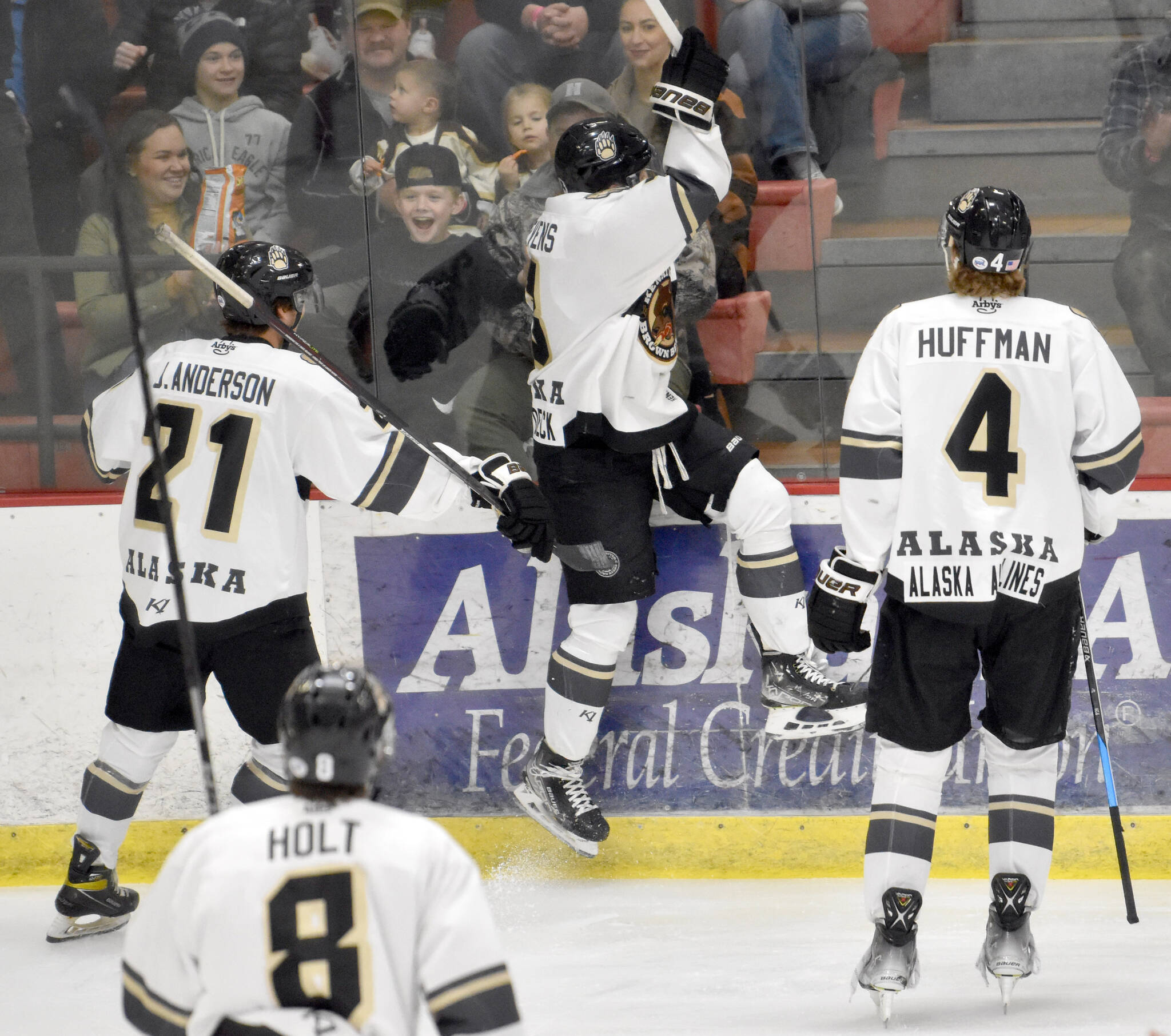 Kenai River’s Nick Stevens celebrates scoring his team’s first home goal of the season Friday, Oct. 14, 2022, against the Fairbanks Ice Dogs at the Soldotna Regional Sports Complex in Soldotna, Alaska. Jack Anderson and Caleb Huffman look on. (Photo by Jeff Helminiak/Peninsula Clarion)