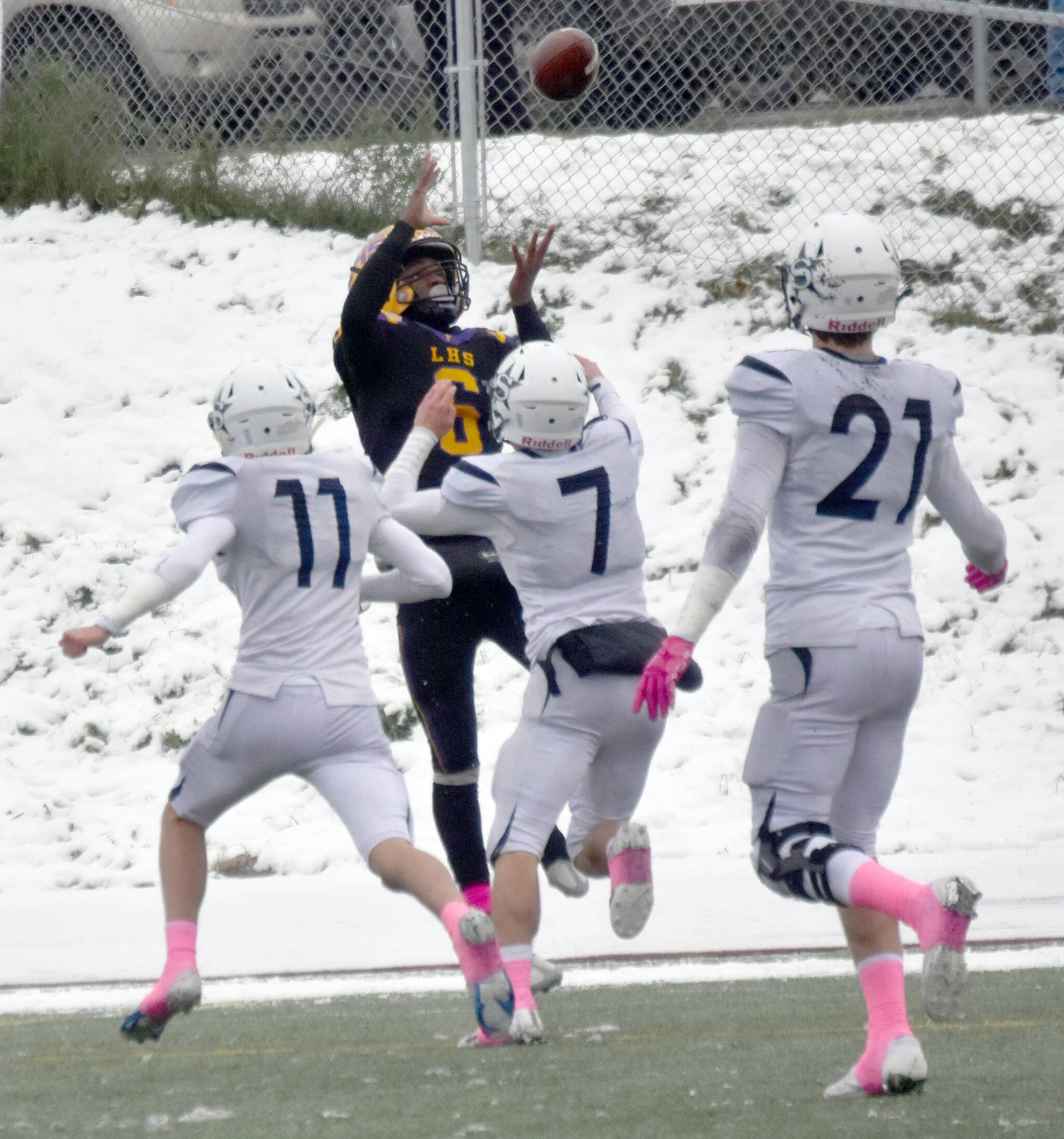 Lathrop’s Earl Parker catches a touchdown over Soldotna’s Talon Gavalis and Zac Buckbee on Saturday, Oct. 15, 2022, in the Division II state championship game at Service High School in Anchorage, Alaska. (Photo by Jeff Helminiak/Peninsula Clarion)