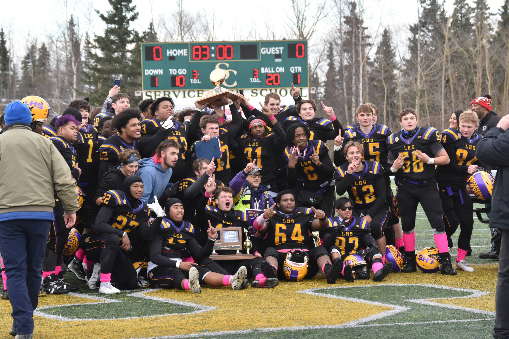 Lathrop celebrates defeating Soldotna for the Division II state title Saturday, Oct. 15, 2022, at Service High School in Anchorage, Alaska. (Photo by Jeff Helminiak/Peninsula Clarion)