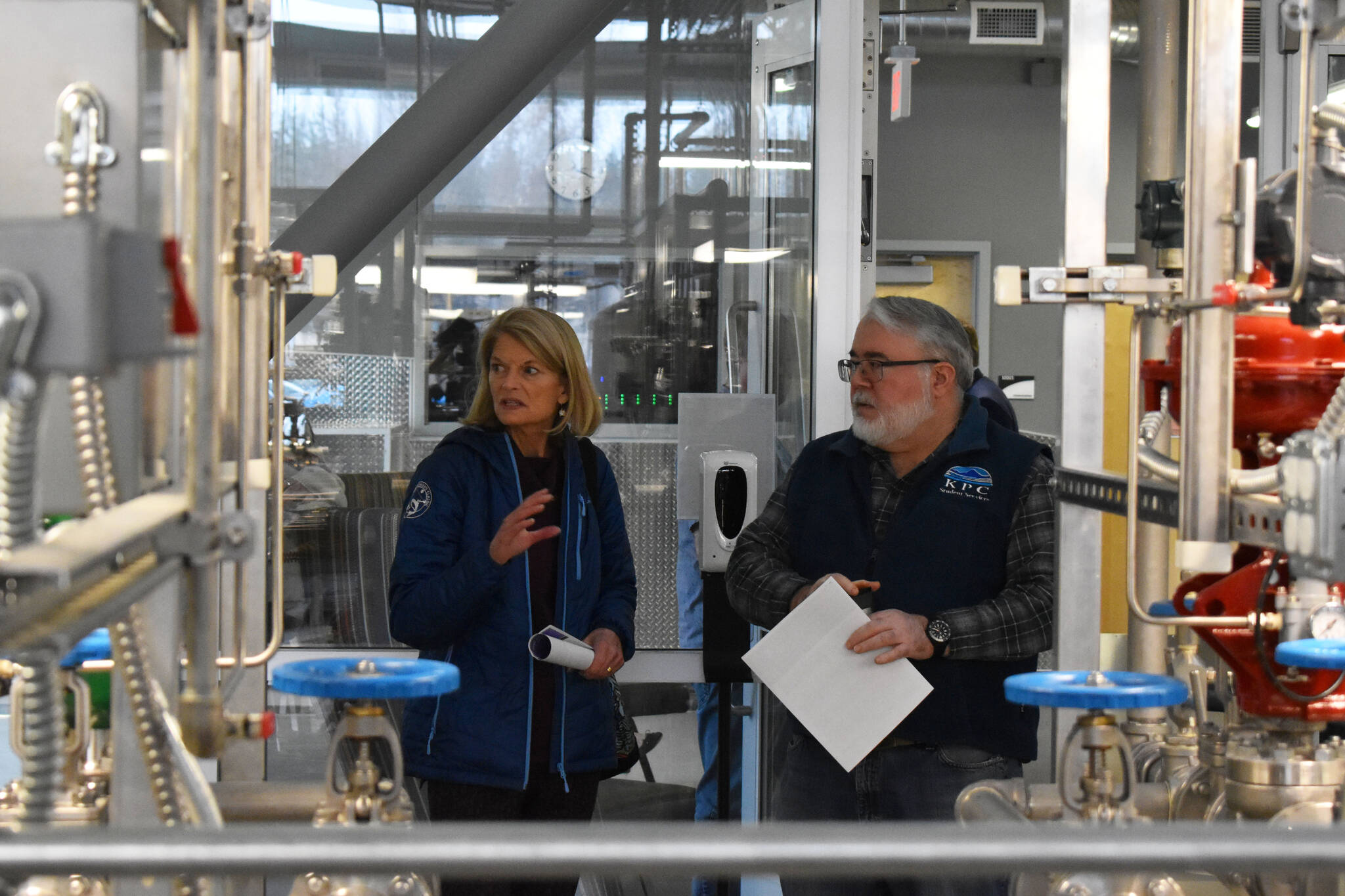 Bill Howell, assistant professor of process technology, shows Sen. Lisa Murkowski, R-Alaska, training equipment at the Career and Technical Education Center at Kenai Peninsula College in Soldotna, Alaska, on Tuesday, Oct. 18, 2022. (Jake Dye/Peninsula Clarion)