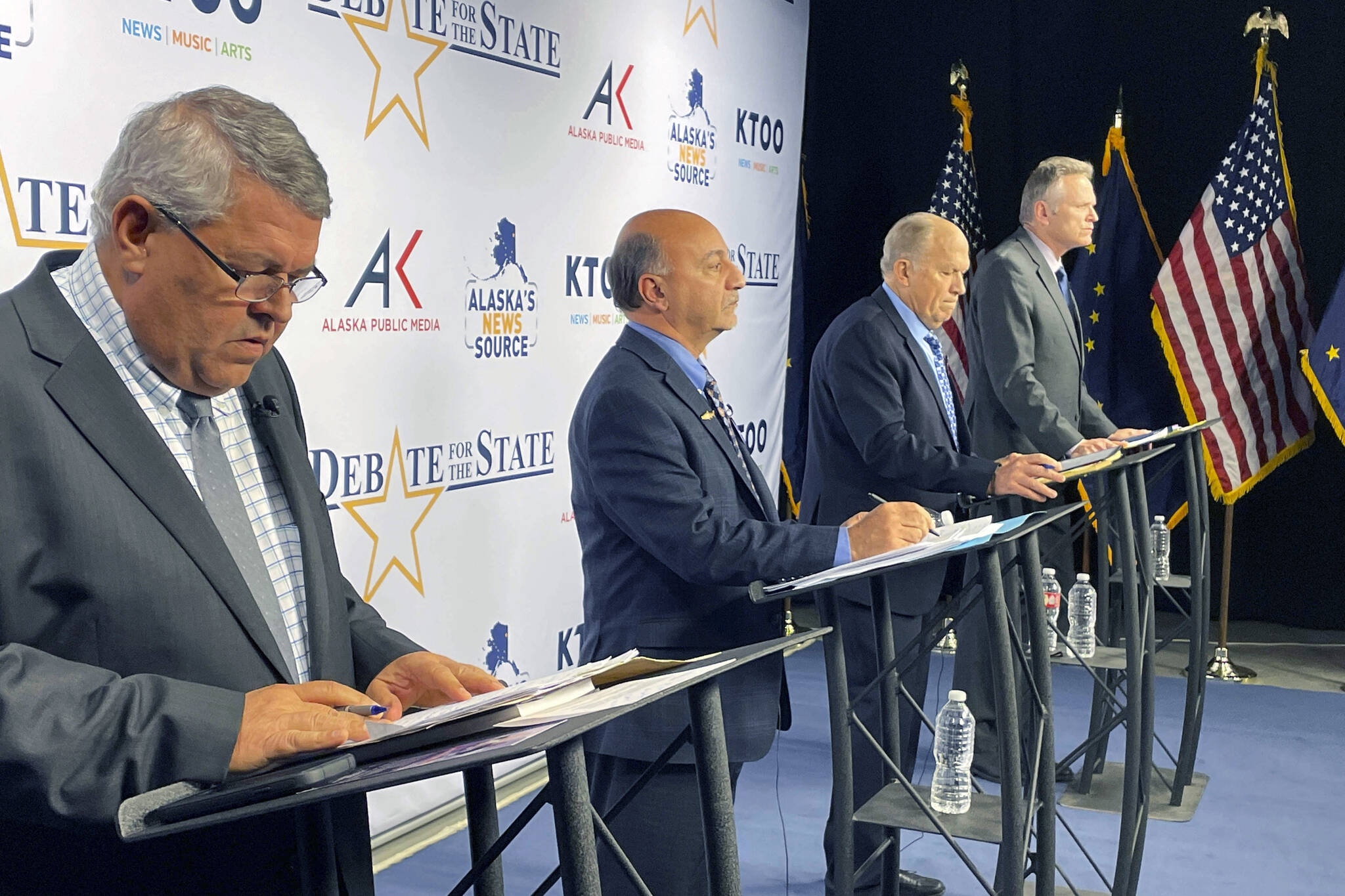 AP Photo / Mark Thiessen 
The four candidates for Alaska governor are shown preparing for a televised debate Wednesday, in Anchorage, ahead of the 2022 general election. From left are Republican Charlie Pierce; Democrat Les Gara; former Gov. Bill Walker, an independent; and Gov. Mike Dunleavy, a Republican.