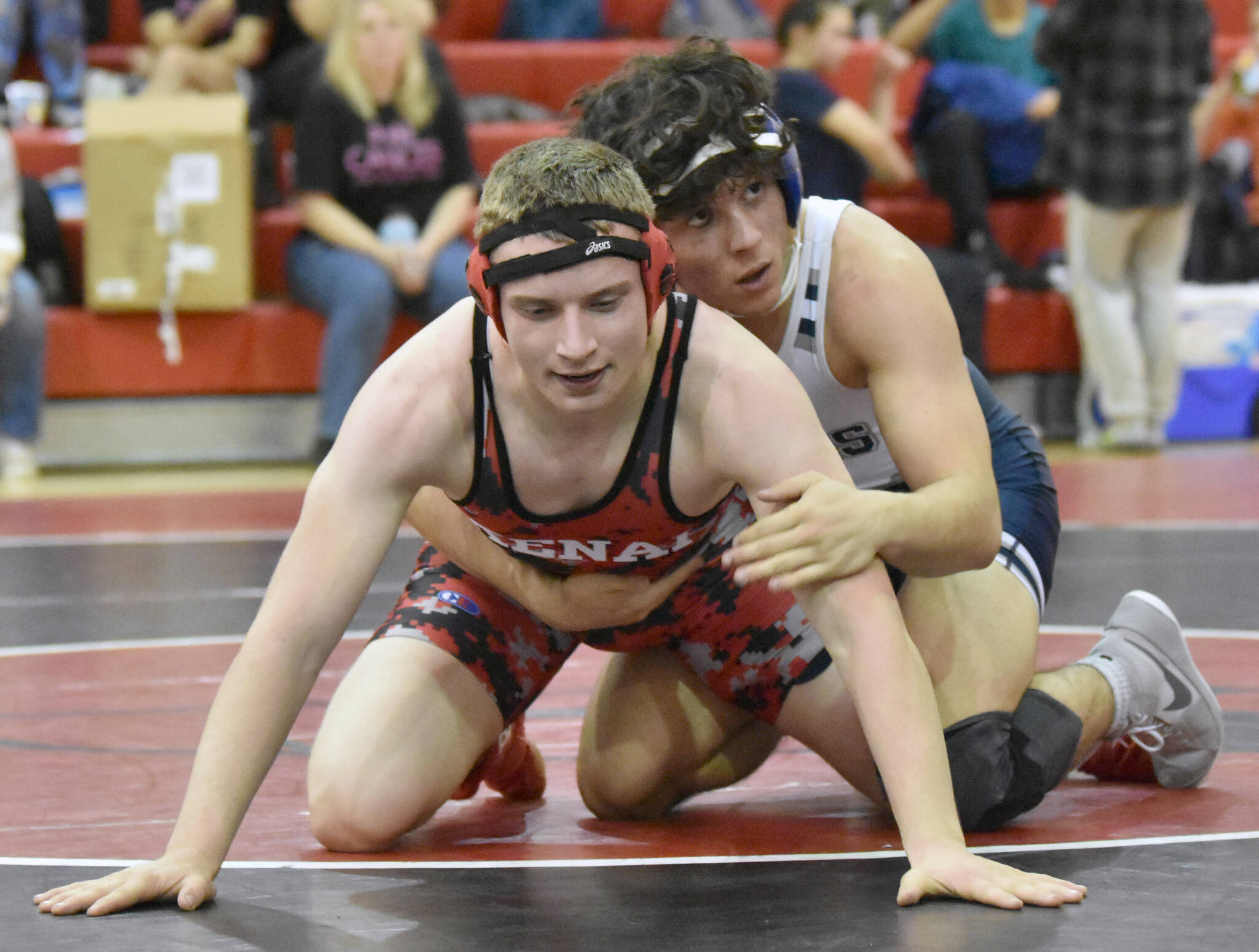Kenai Central’s Andrew Gaethle and Soldotna’s Isaac Chavarria wrestle at 152 pounds at the Luke Spruill Memorial Tournament on Saturday, Oct. 22, 2022, at Kenai Central High School in Kenai, Alaska. Chavarria won by technical fall. (Photo by Jeff Helminiak/Peninsula Clarion)