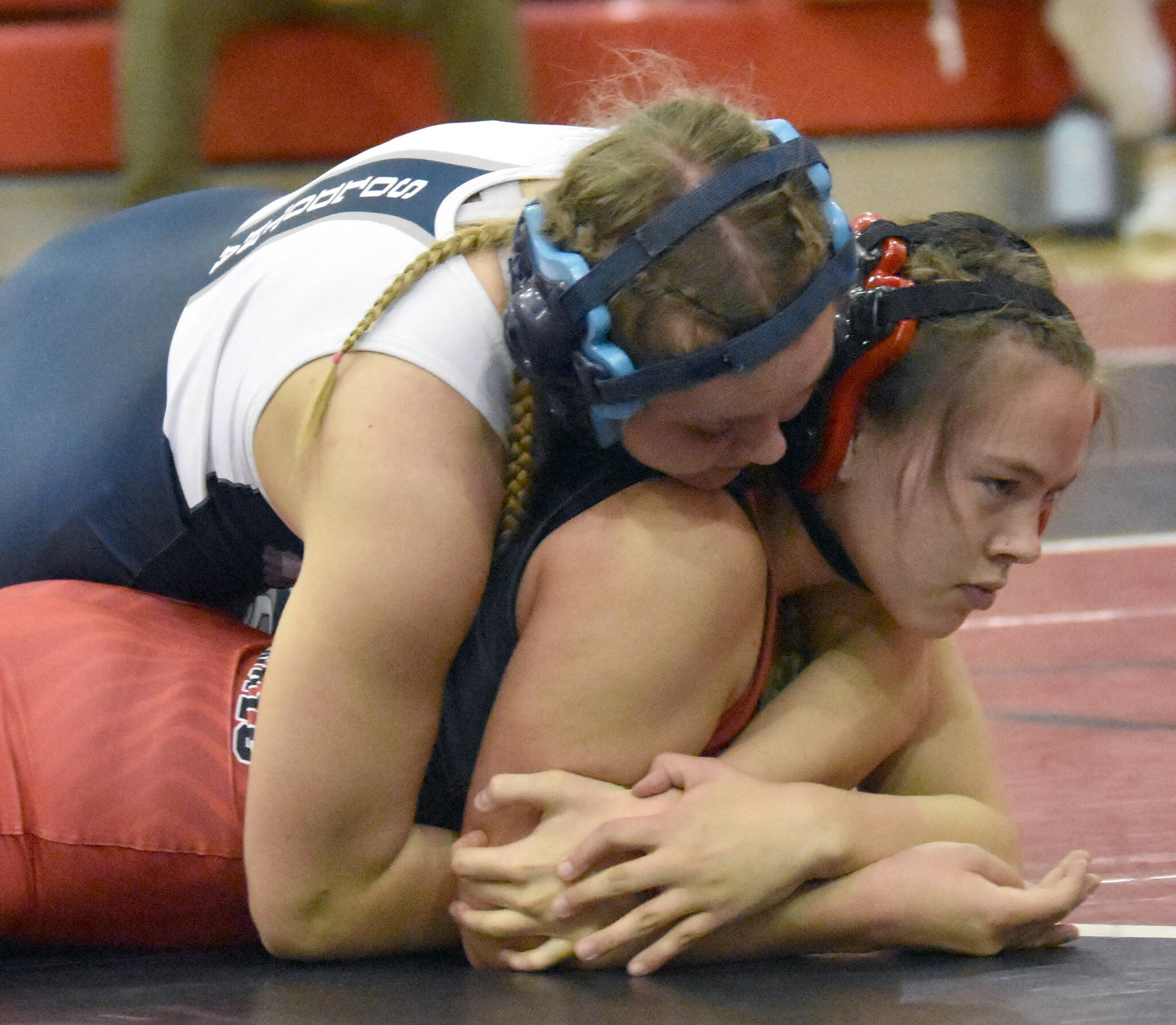 Soldotna’s Daisy Hannevold wrestles with Kenai Central’s Jalyn Yeoman at girls 138 pounds at the Luke Spruill Memorial Tournament on Saturday, Oct. 22, 2022, at Kenai Central High School in Kenai, Alaska. Hannevold was able to pin Yeoman. (Photo by Jeff Helminiak/Peninsula Clarion)